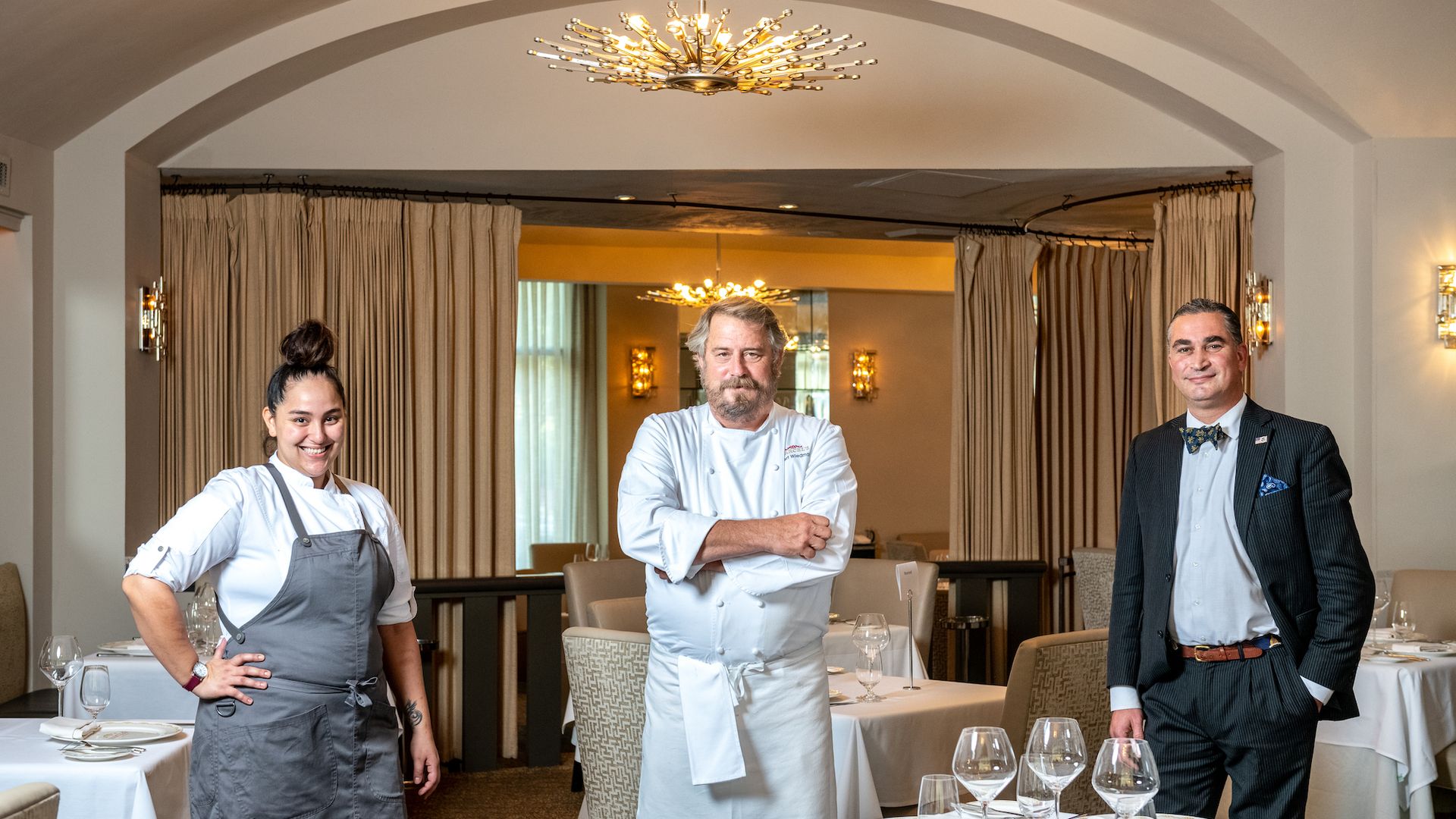 Jenn Castaneda-Jones, executive chef Robert Wiedmaier, maitre d' Adnane Kebaier pictured in the dining room at Marcel's 
