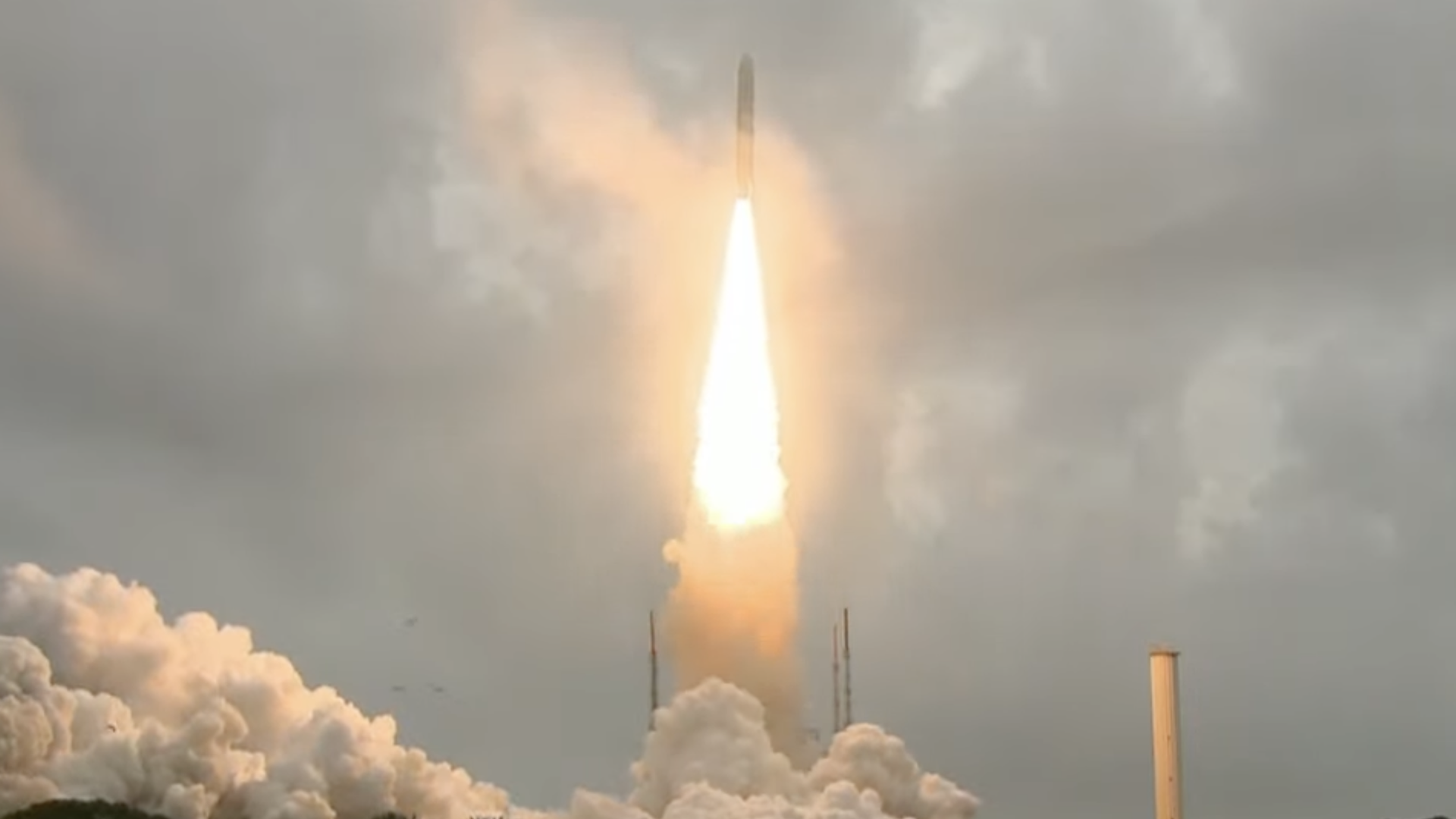 The launch of the James Webb Space Telescope. A rocket launches into clouds