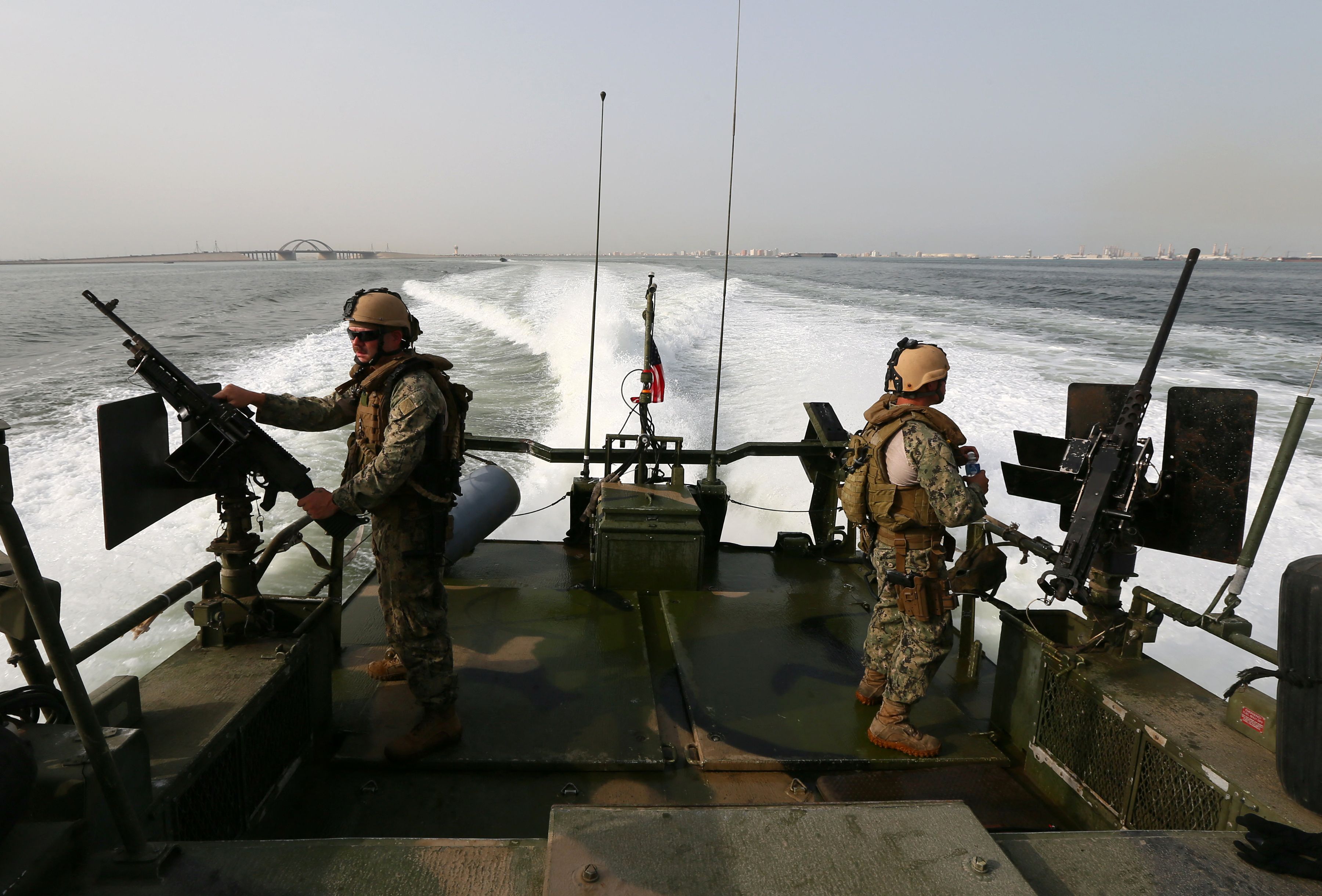 U.S Navy personnel aboard a boat off the coast of Bahrain's Salman port in May 2013.