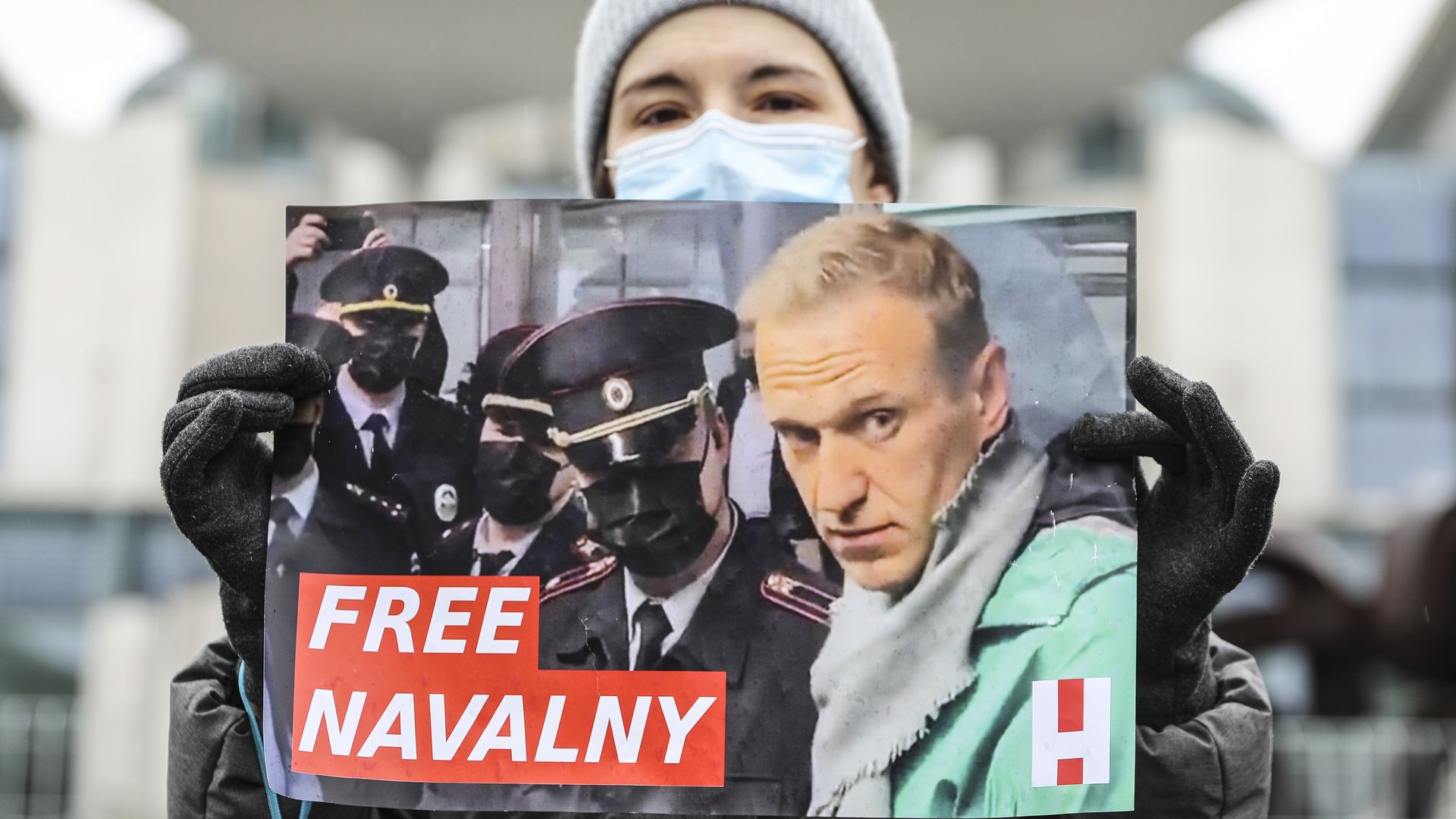 Protester holding Free Navalny sign
