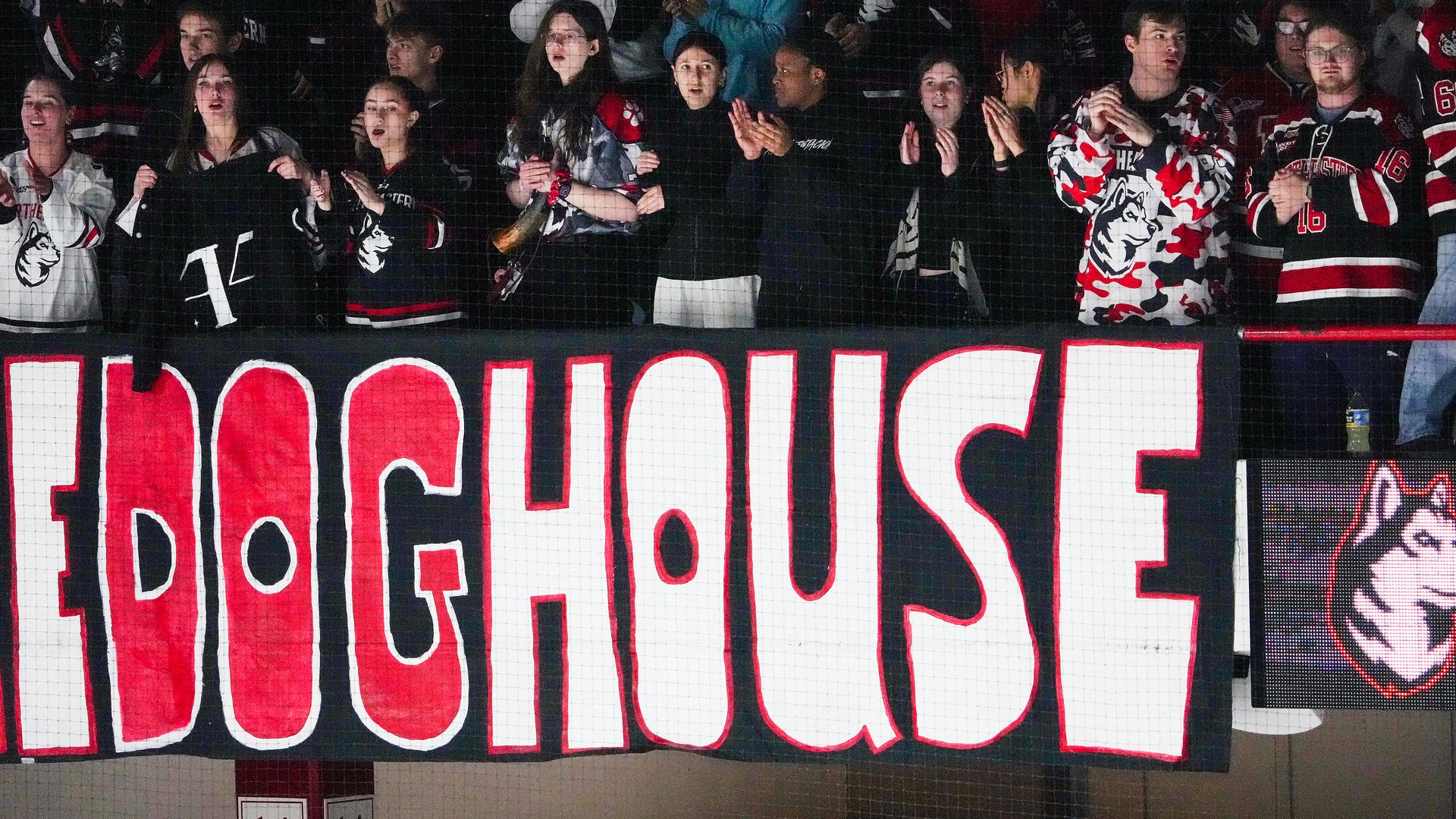 Fans clap and look as Northeastern plays Boston College in the 2025 women's beanpot semi-finals. Northeastern won