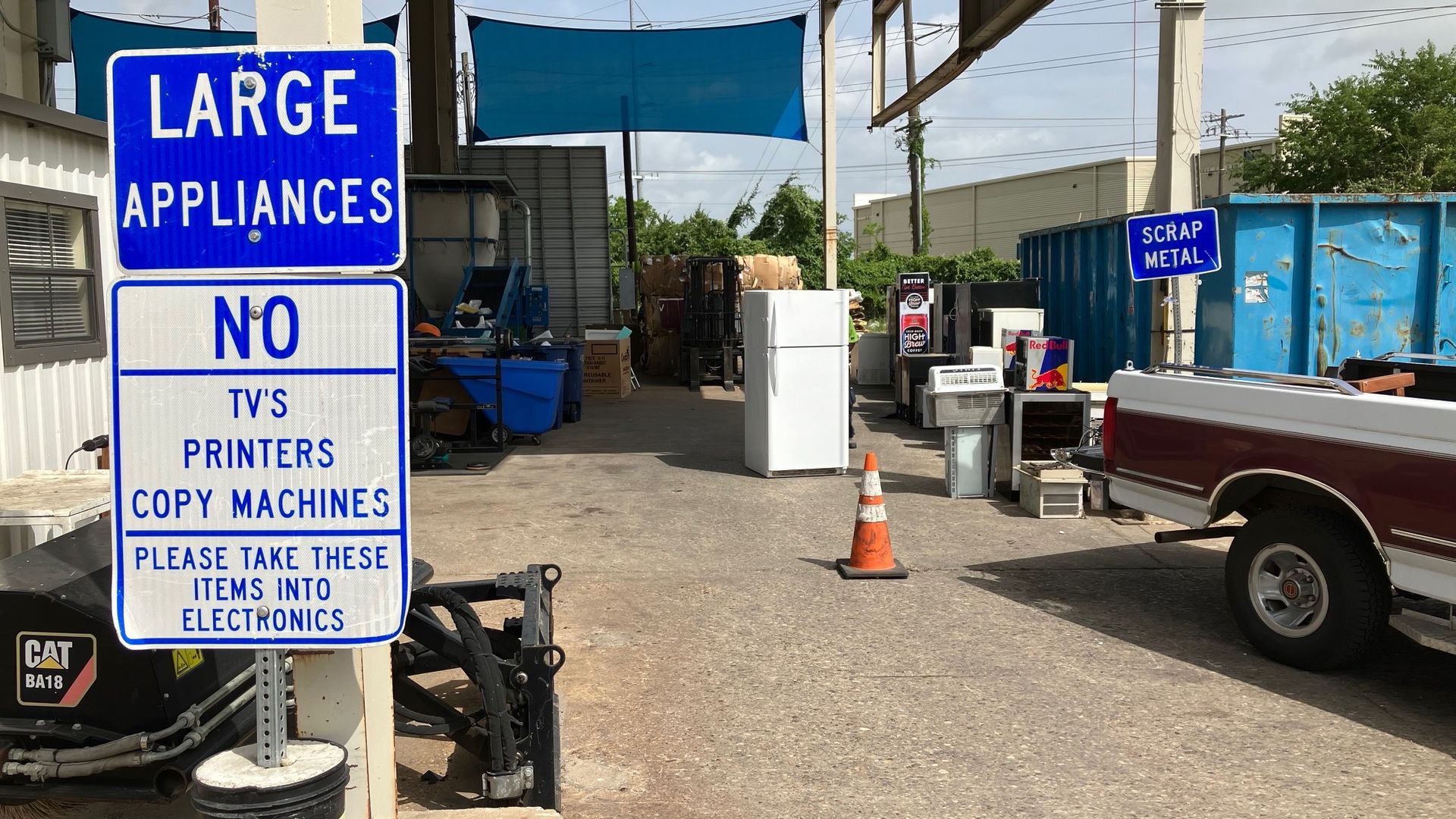 A refrigerator stands in a city recycling facility.