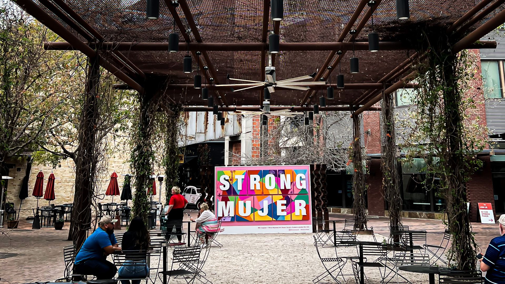 A park at Pearl is anchored by the "Strong Mujer" art installation. 
