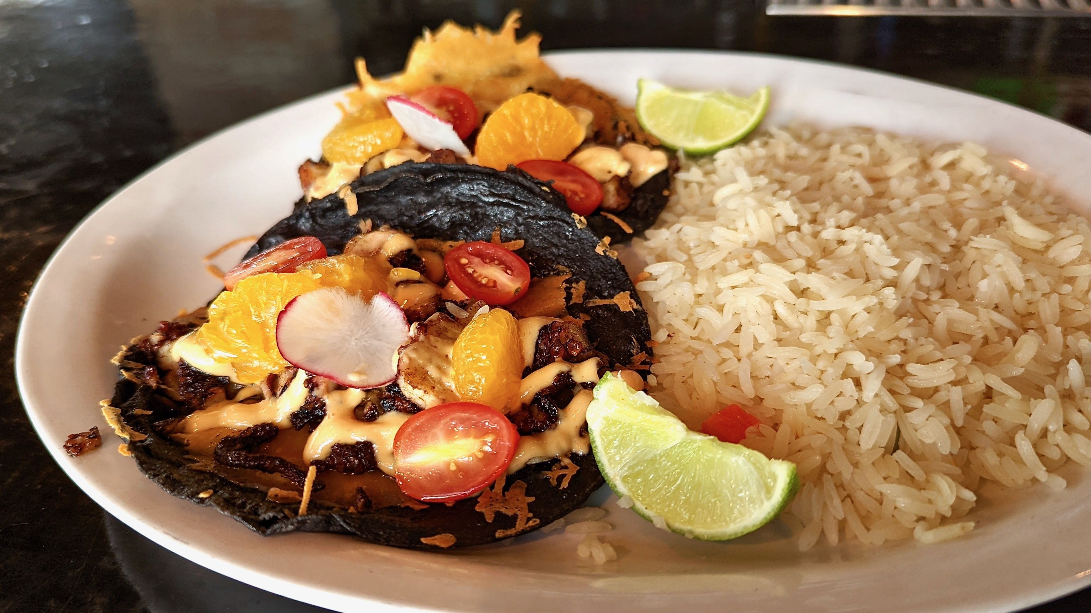 octopus tacos with rice on a plate