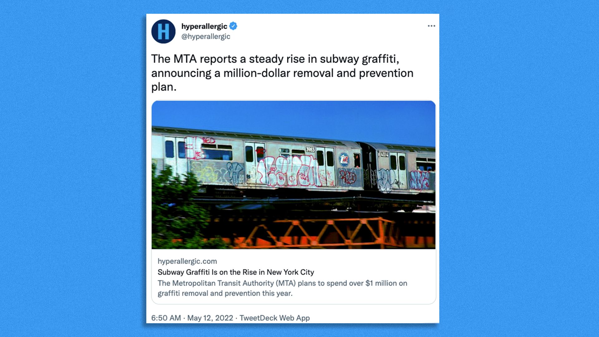 A tweet of a subway car covered in graffiti