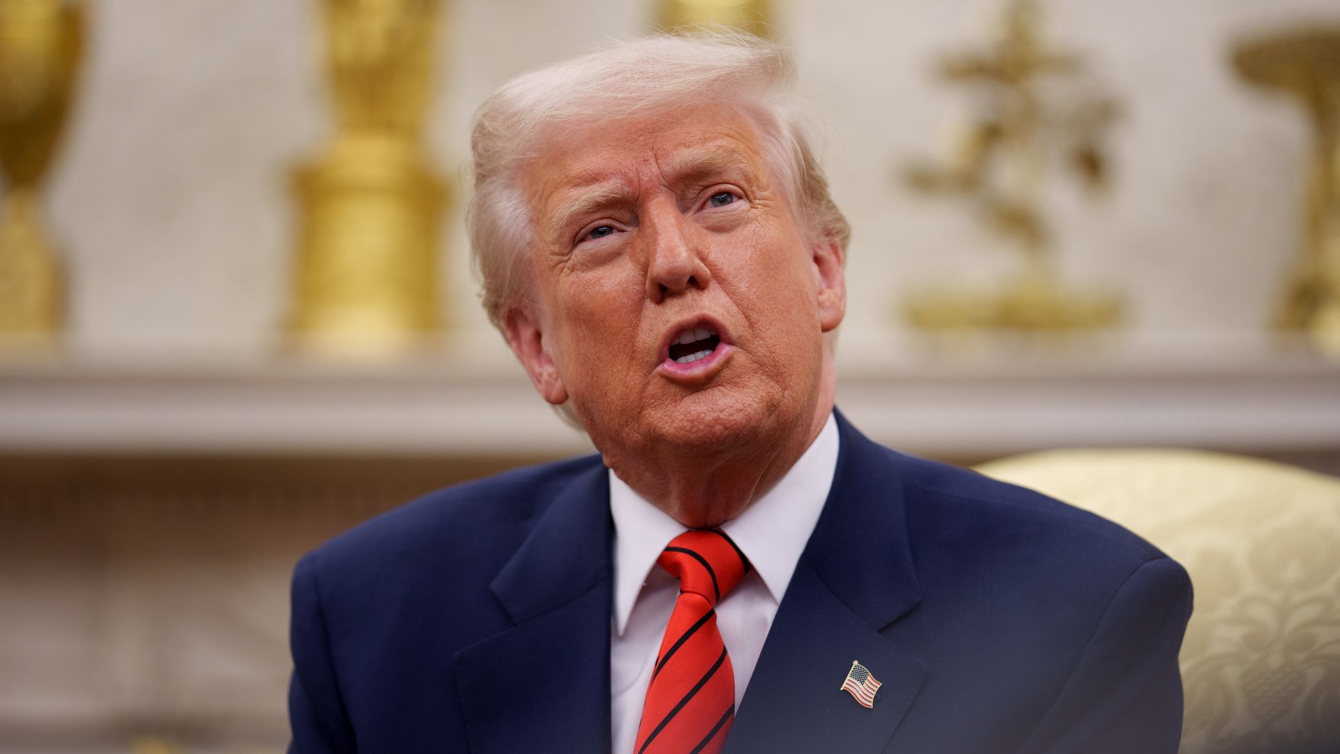 Trump talks during a meeting in the Oval Office.