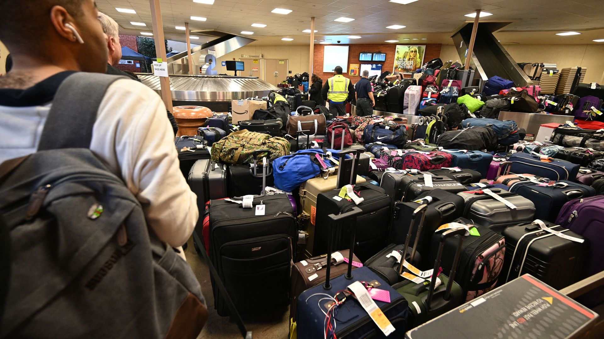 Newly arrived Southwest Airlines passengers wait for their luggage to arrive at Hollywood Burbank Airport in Burbank, California, on December 27, 2022