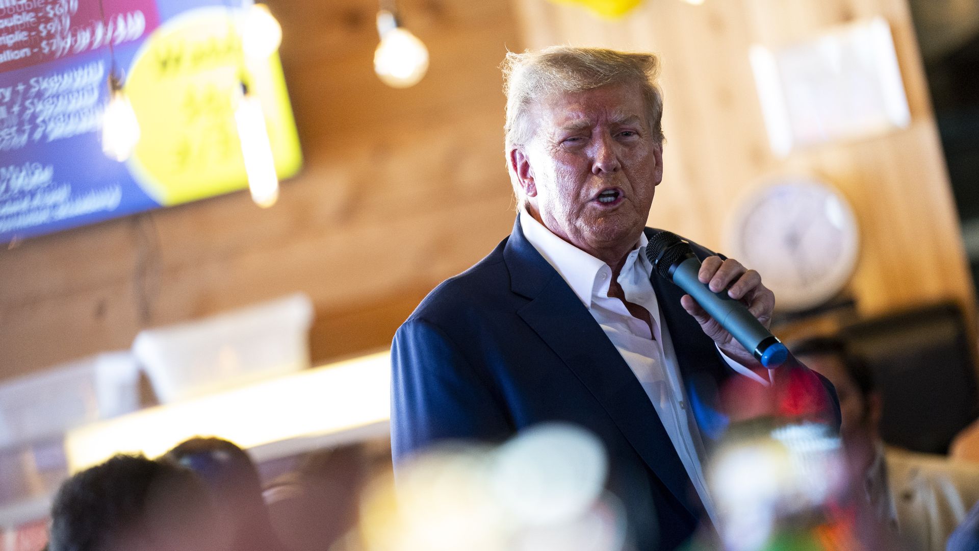 Former President Donald Trump, 2024 Republican presidential candidate, speaks at the Steer N' Stein bar while attending the Iowa State Fair in Des Moines, Iowa, US, on Saturday, Aug. 12, 2023.