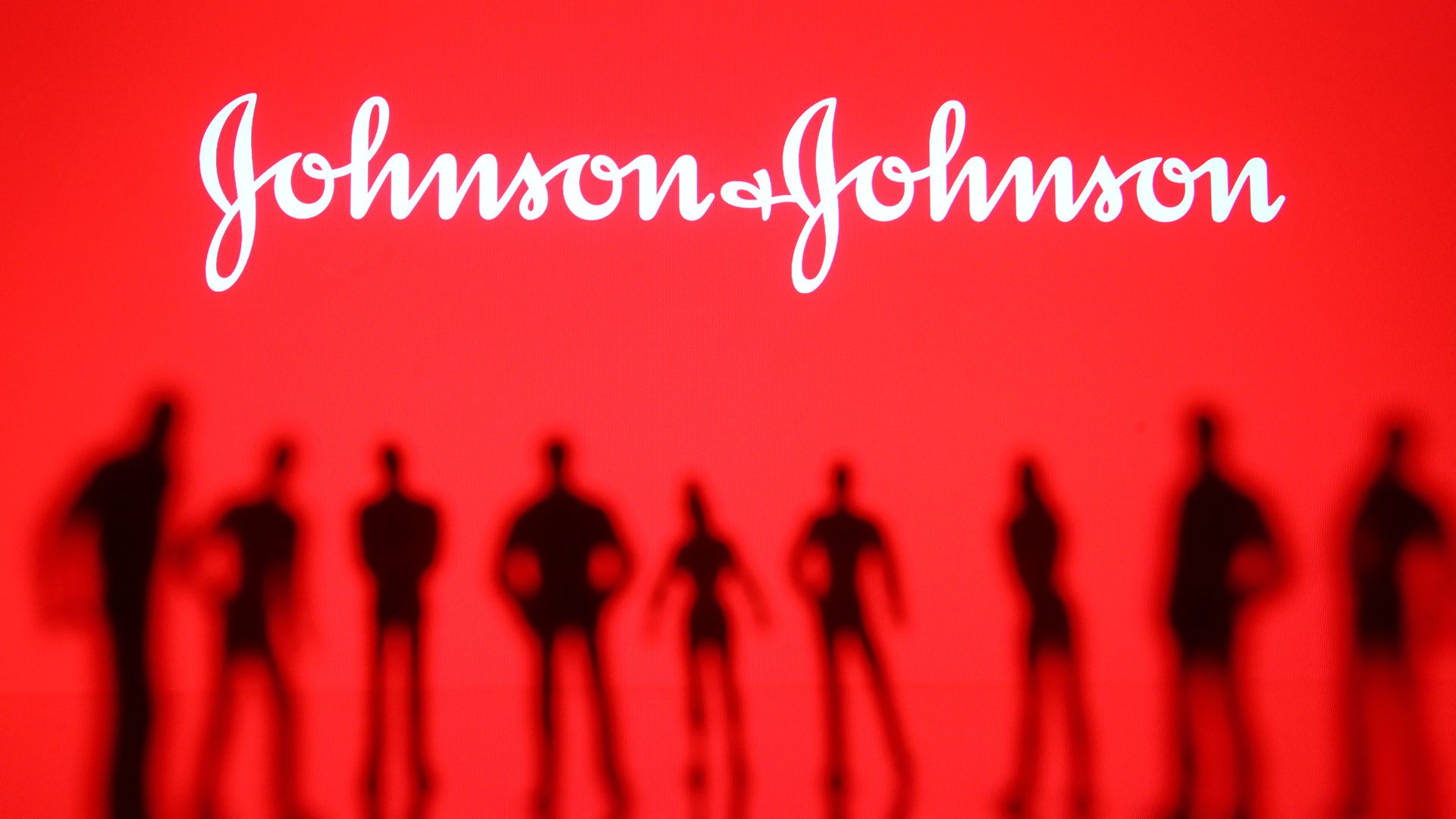 illustration of Johnson and Johnson logo above shadows of people