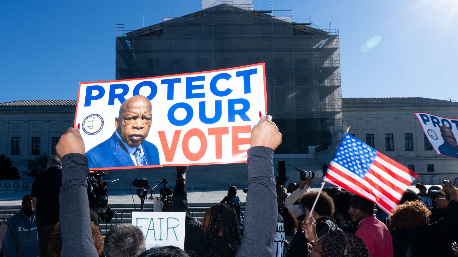 Voting rights activists protest outside the U.S. Supreme Court as the court prepares to hear arguments in a case challenging Louisiana's congressional map in Washington on Wednesday, October 15, 2025. (Bill Clark/CQ-Roll Call, Inc via Getty Images)