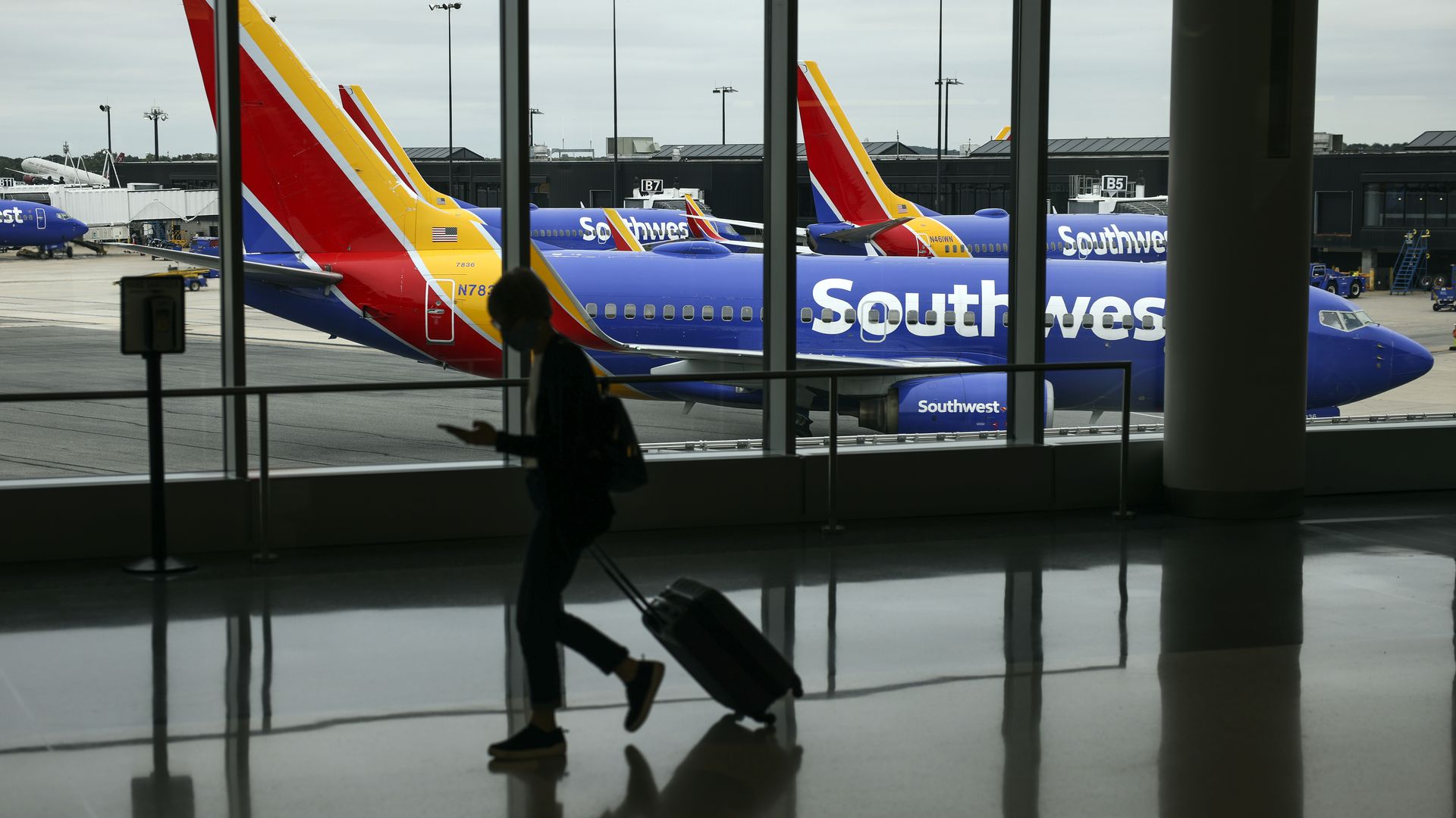 A person walking past a Southwest Airlines airplane Baltimore Washington International Thurgood Marshall Airport on Oct. 11.