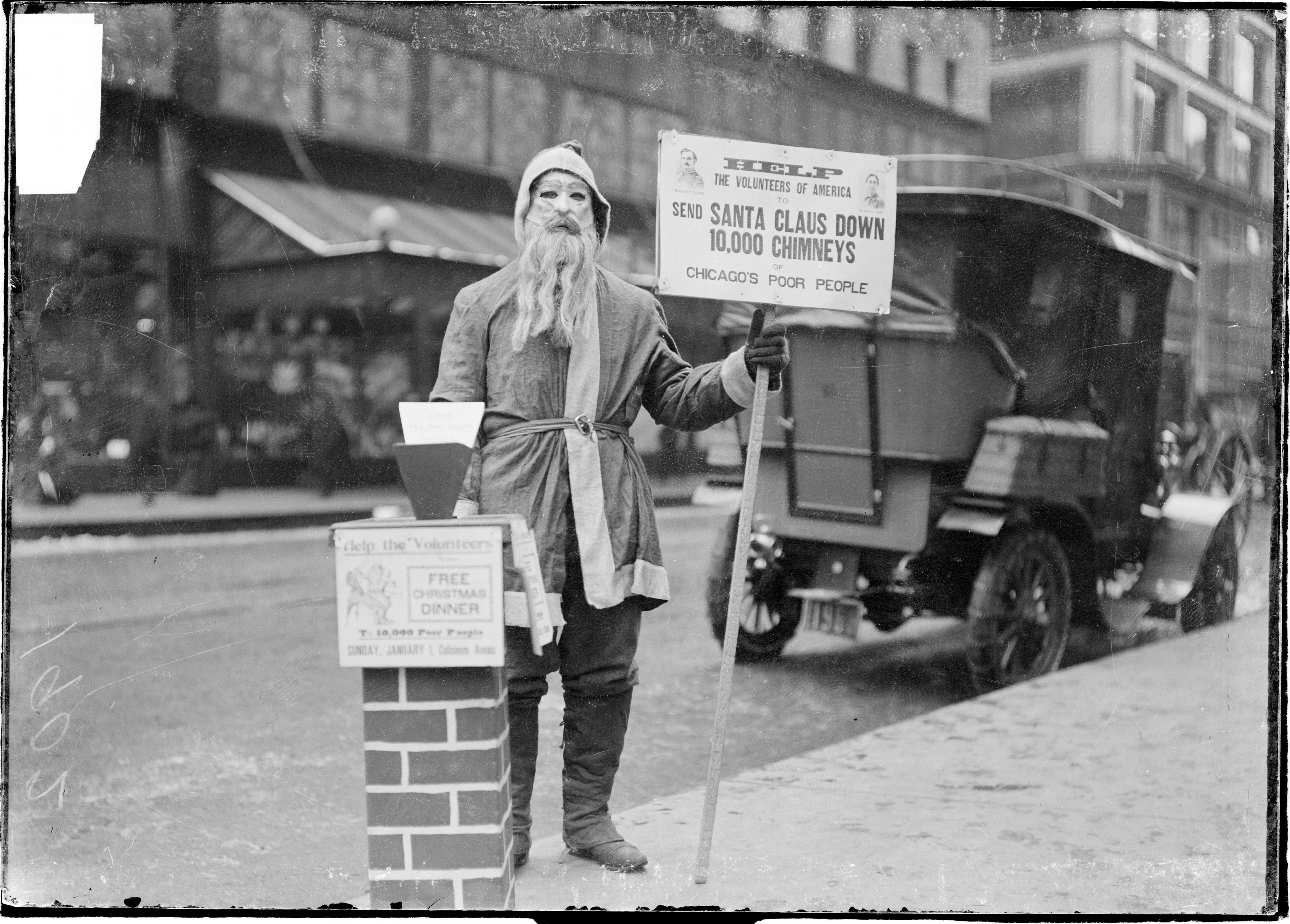 Photo of a Santa Claus collecting money on the street 