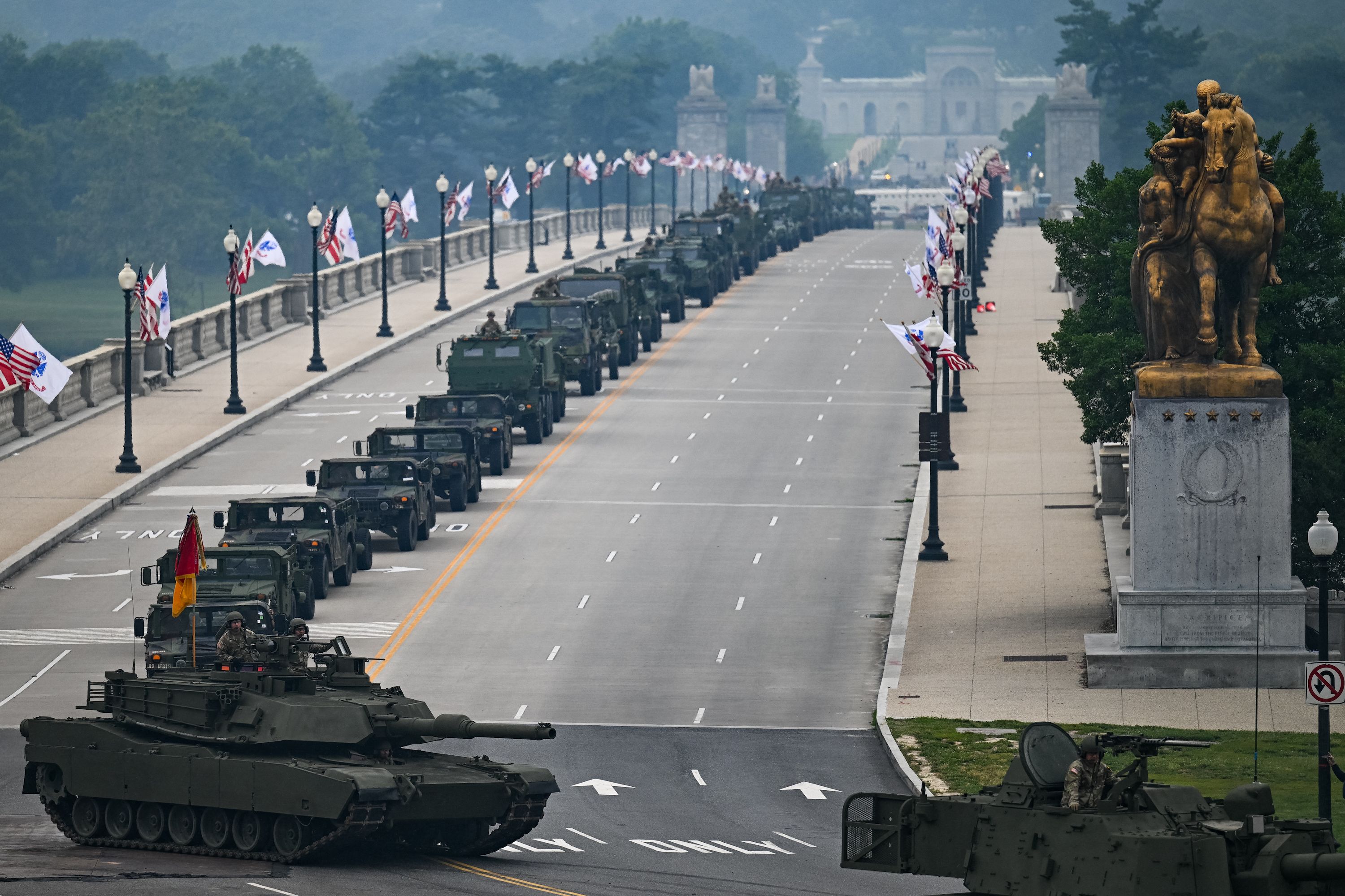 Armored vehicles move across the Memorial Bridge during the Army 250th Anniversary Parade in Washington, DC, on June 14, 2025.