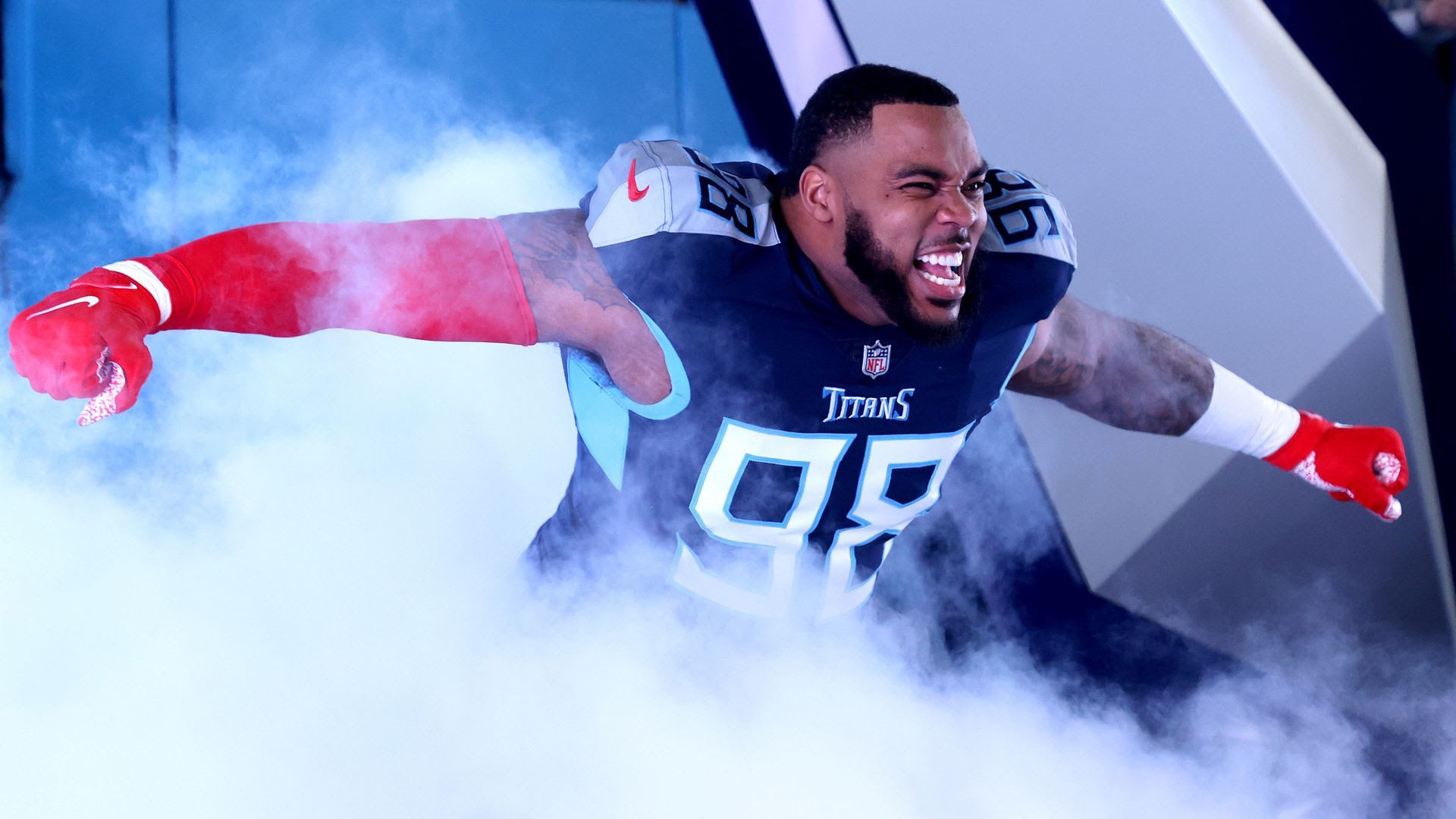 Titans defensive lineman Jeffery Simmons celebrates as he runs out of the tunnel.