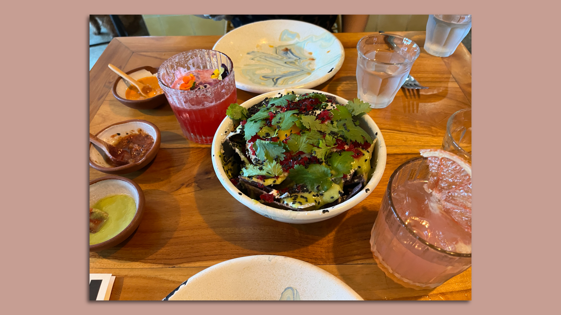 Chilaquiles and two cocktails are pictured from Los Felix.
