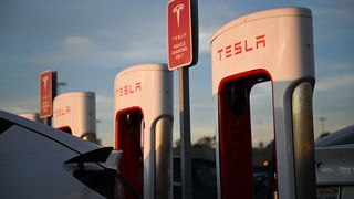 A Tesla, Inc. electric vehicle charges at the supercharger location in Hawthorne, California.