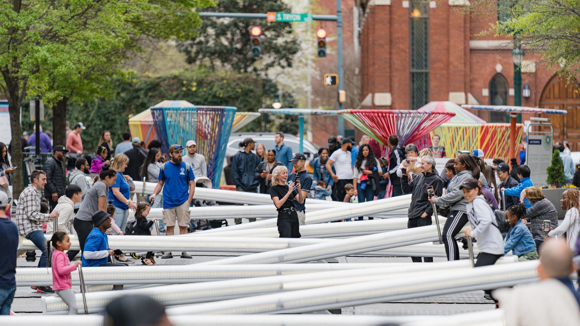 People on see-saws at festival