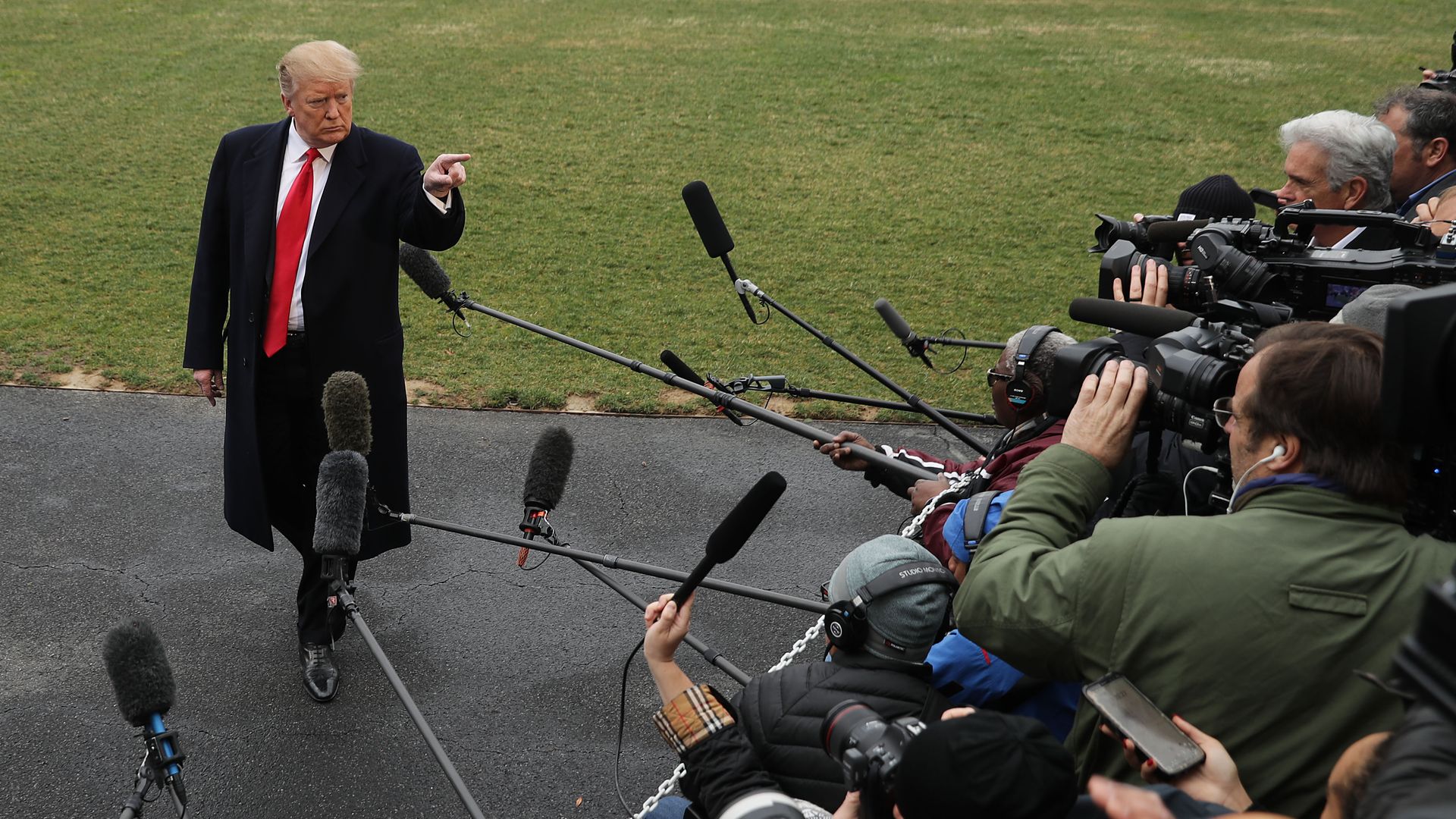 Trump pointing at reporters