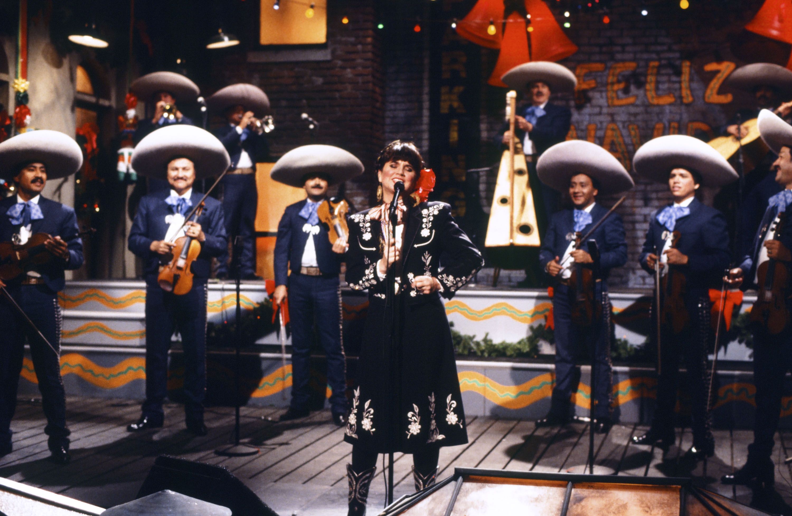 A singer with a mariachi band. 