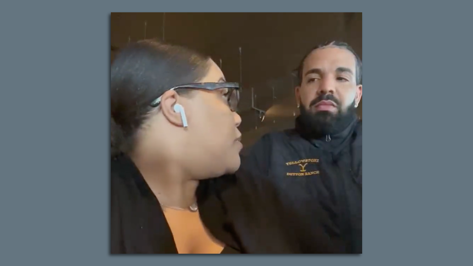 Brittney DeSouza-Williams looks back to see multiplatinum recording artist Drake behind her at Joe Muer Seafood in Detroit.