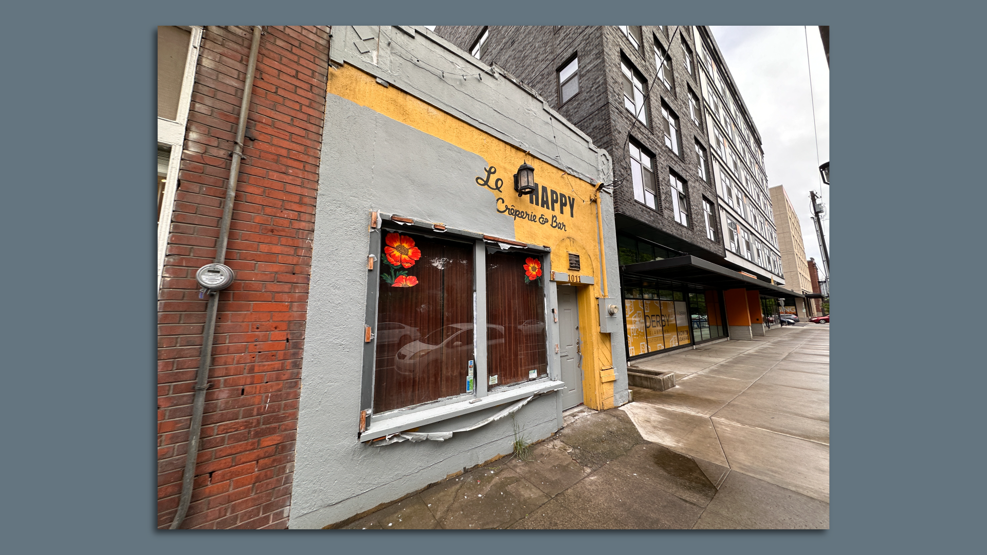 Closed down restaurant in Portland painted yellow and grey