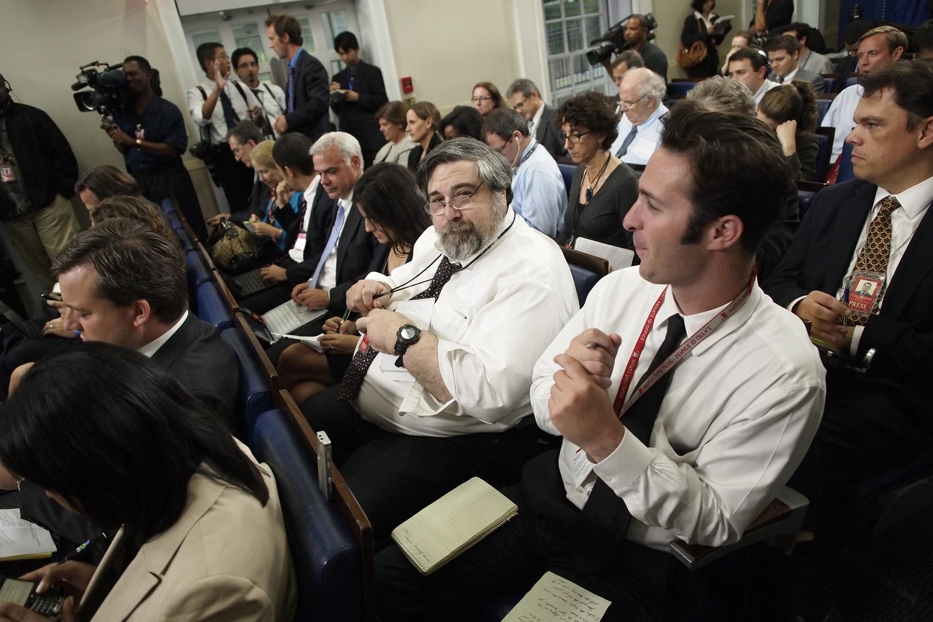 Mark Knoller of CBS News, center, waits for the start of the daily press briefing by White House press secretary Jay Carney at the White House in Washington,  D.C., on Sept. 7, 2011. / Charles Dharapak / AP