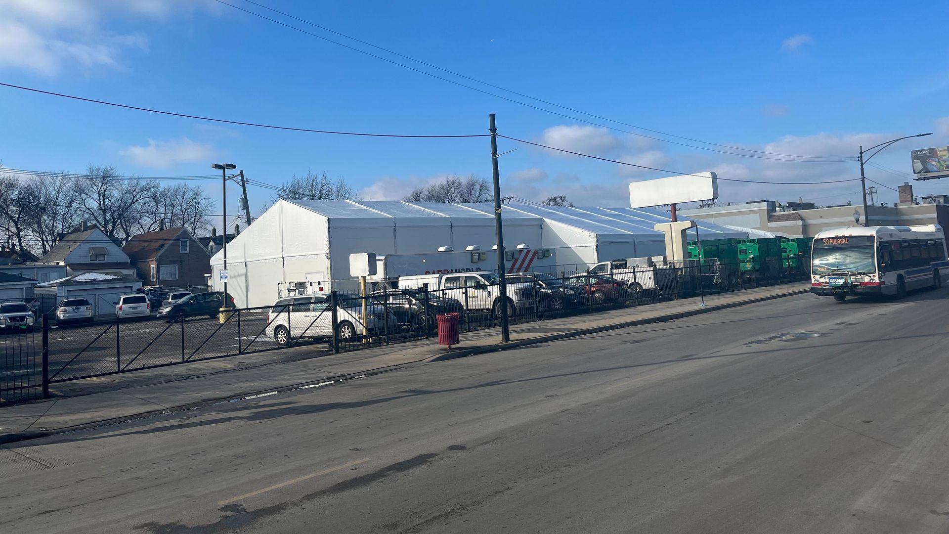 Photo of a tent shelter alongside a road 