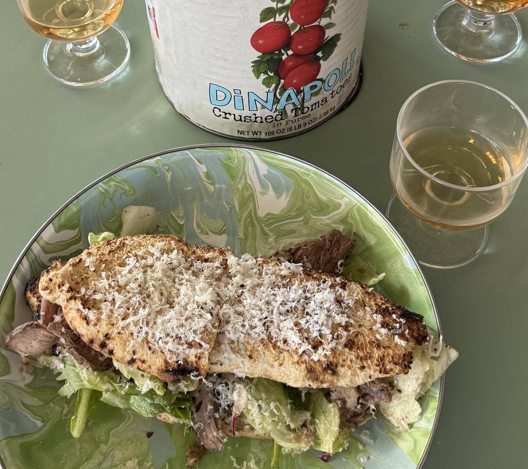 A photo of a sandwich on a green plate.