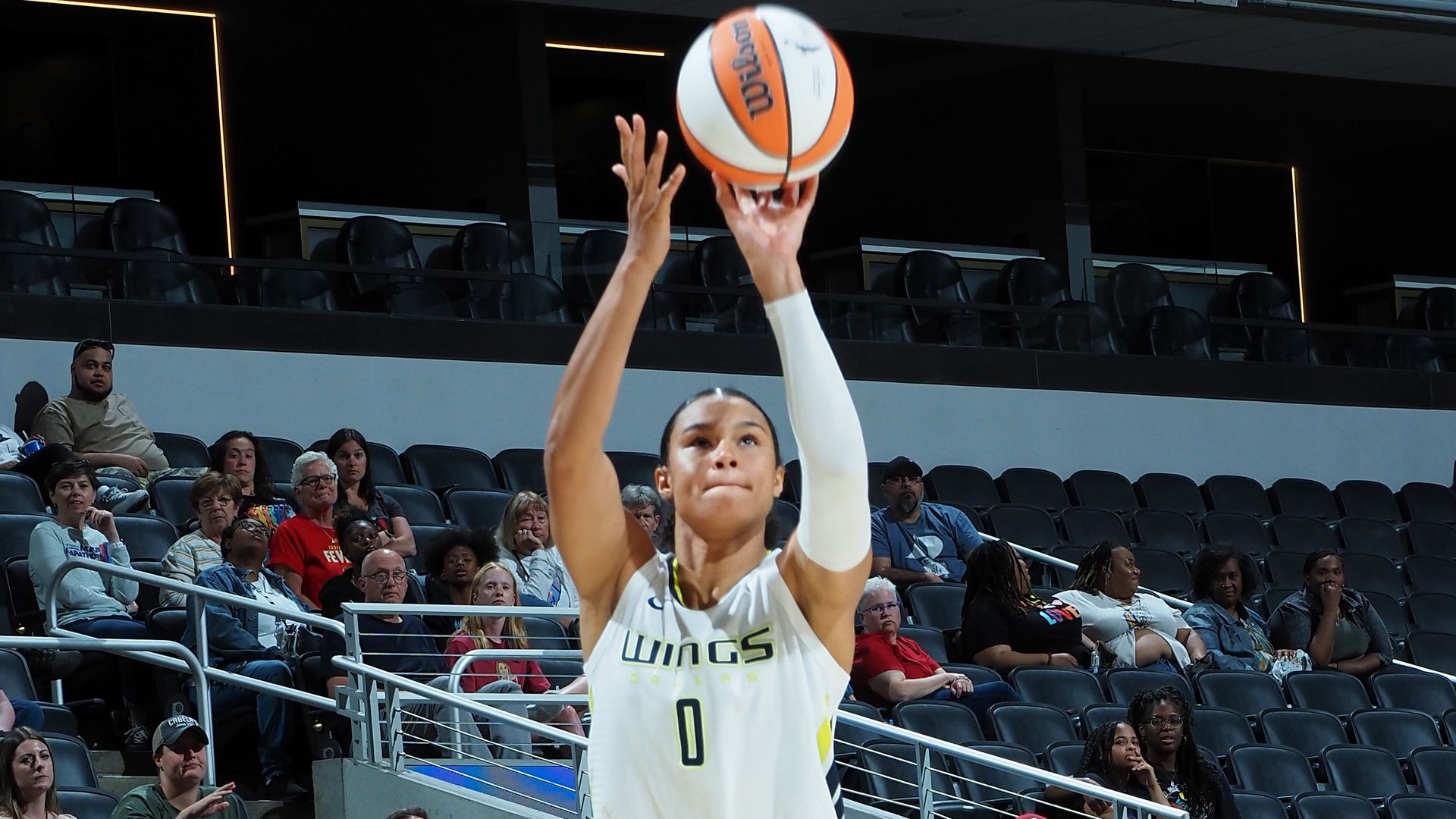 Satou Sabally shoots a basketball from the three-point line.