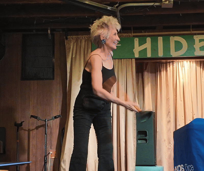 woman twirling a plunger