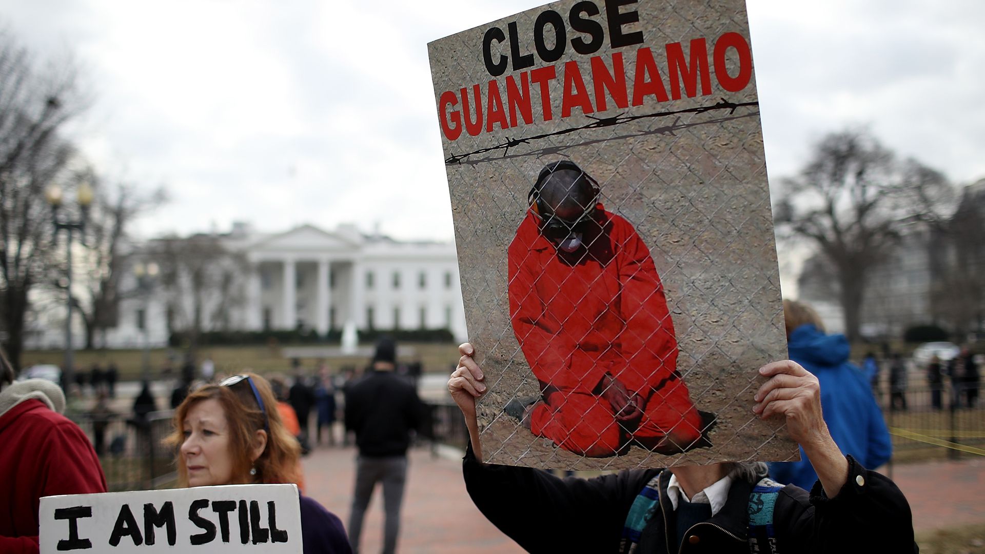 Activists protest the continued operation of the Guantanamo Bay detention camp in front of the White House.