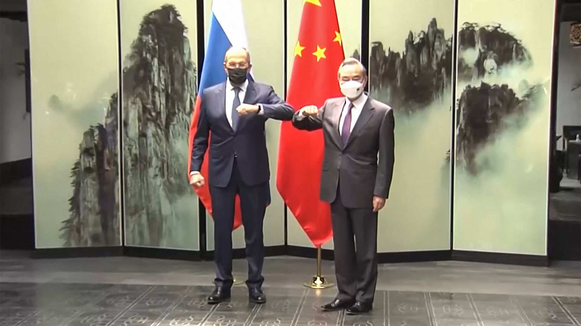 This screengrab taken on March 30, 2022 from video by state broadcaster CCTV via AFPTV shows Russian Foreign Minister Sergei Lavrov (L) meeting his Chinese counterpart Wang Yi 