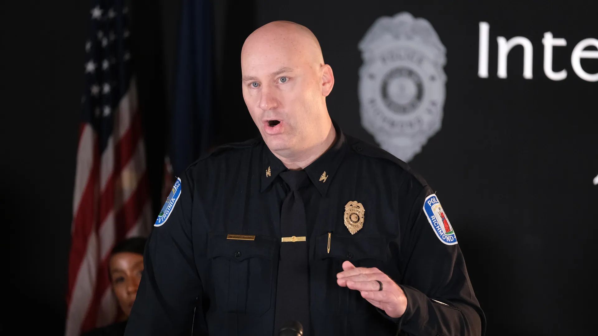 a policer officer talking at a press conference