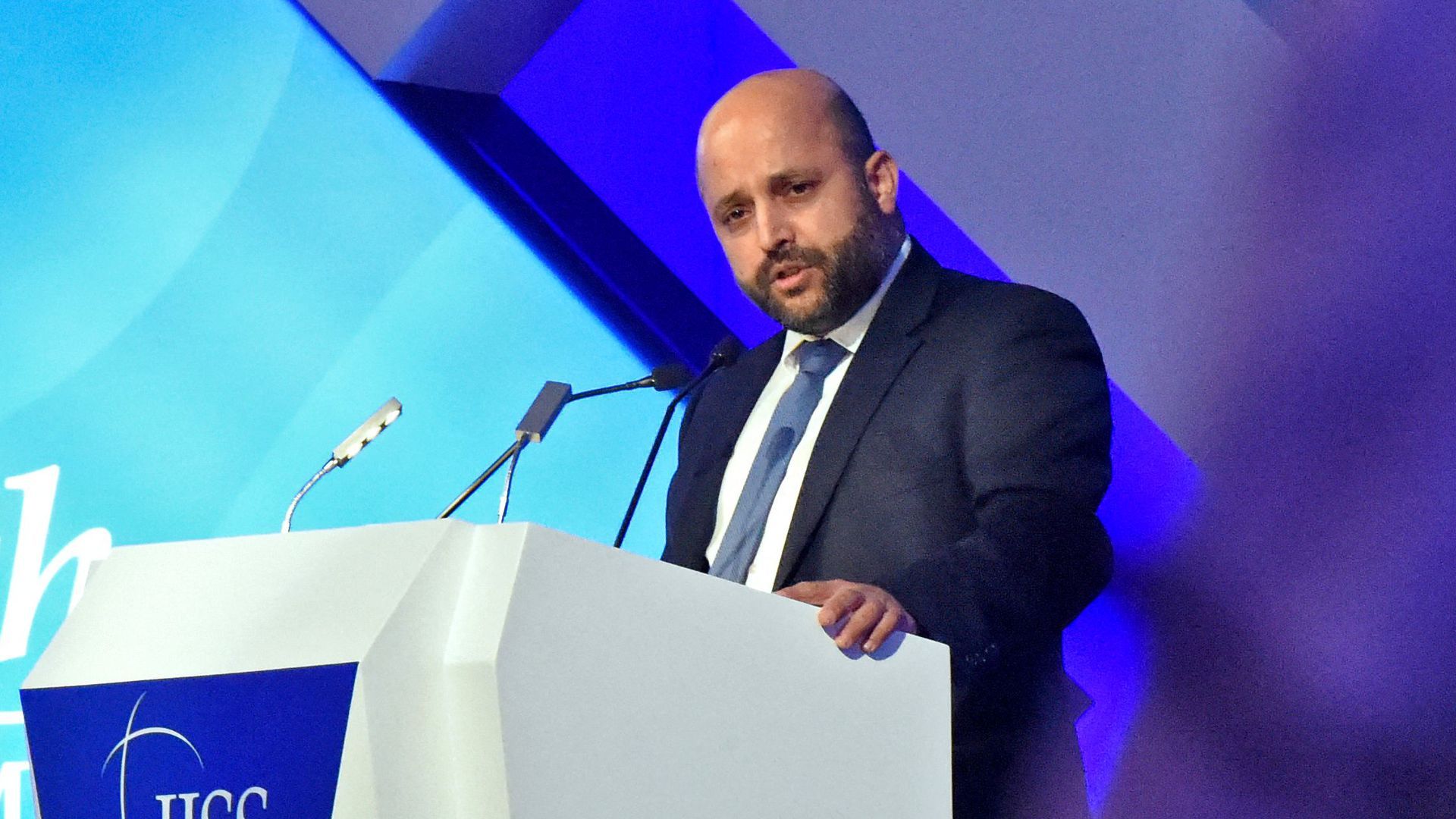 Eyal Hulata standing at a podium