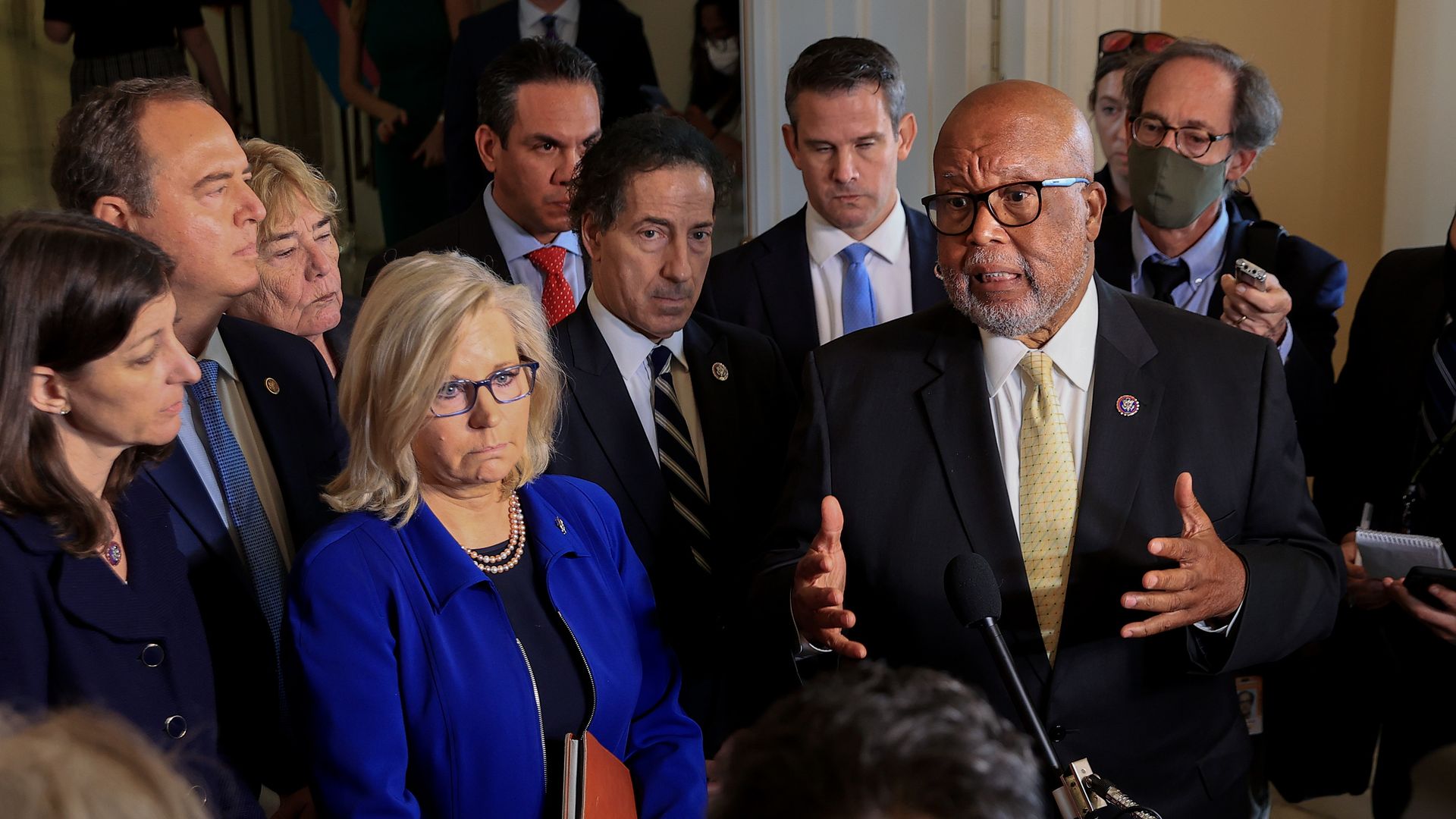 Chairman Rep. Bennie Thompson (D-MS) (R) and Rep. Liz Cheney (R-WY) (C), joined by fellow committee members, speak to the media.