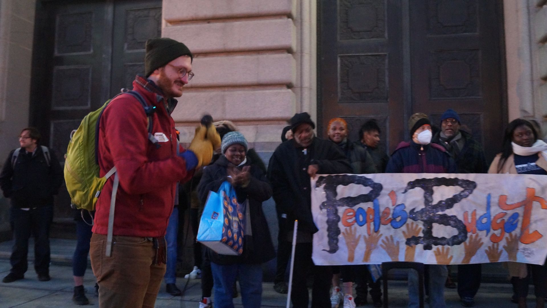 Organizer Jonathan Welle and the People's Budget Cleveland supporters outside City Hall in January