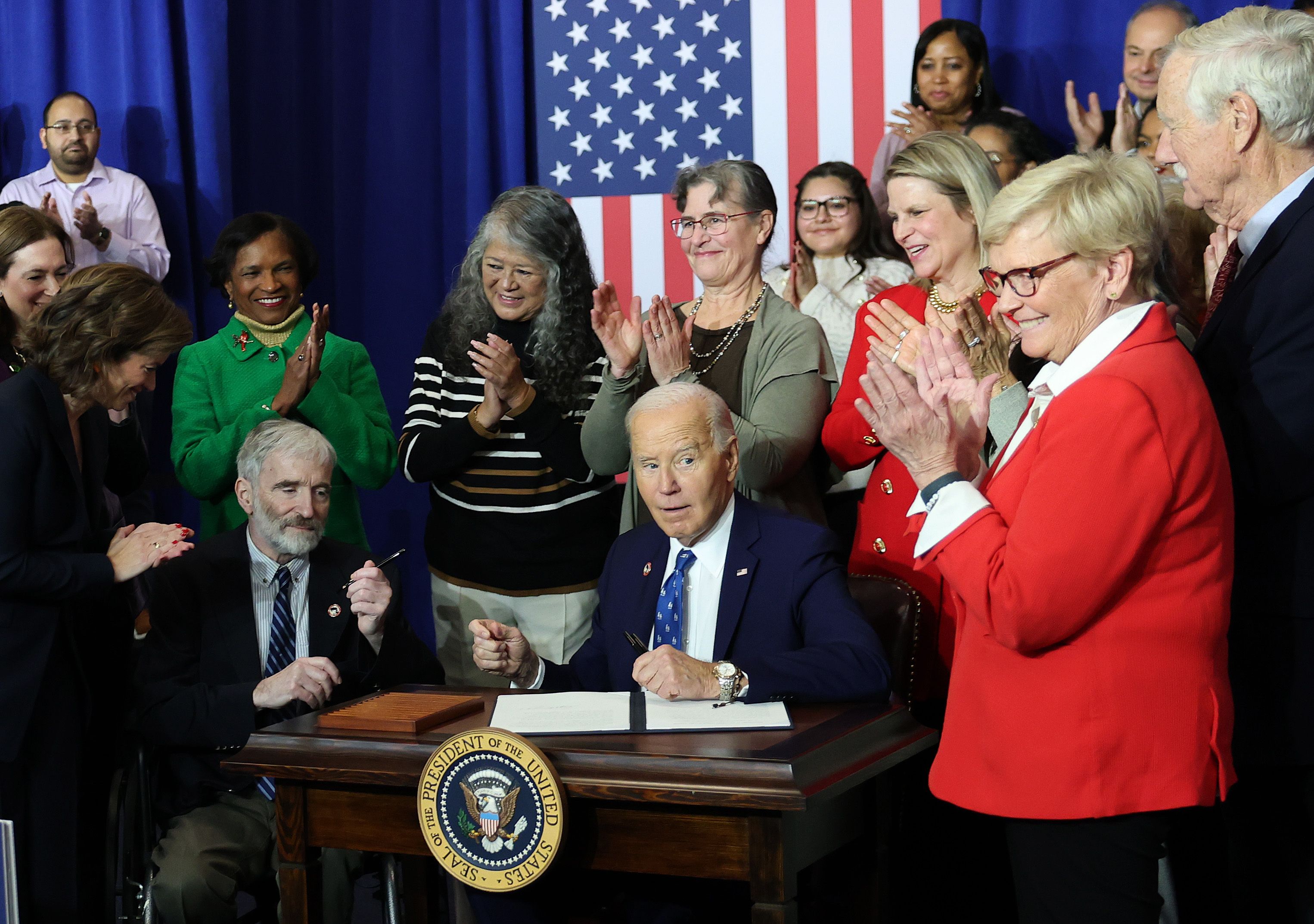 President Biden — joined by lawmakers and labor leaders at the Department of Labor yesterday — signs a proclamation establishing the Frances Perkins National Monument, in Maine, to honor the first female Cabinet secretary, who served under FDR. Photo: Kevin Dietsch/Getty Images