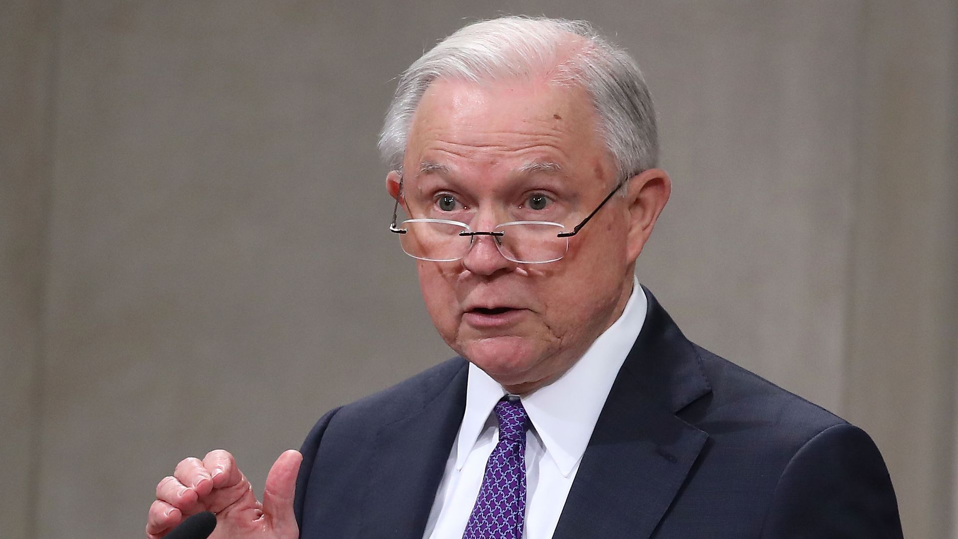 Jeff Sessions speaking into the microphone. 