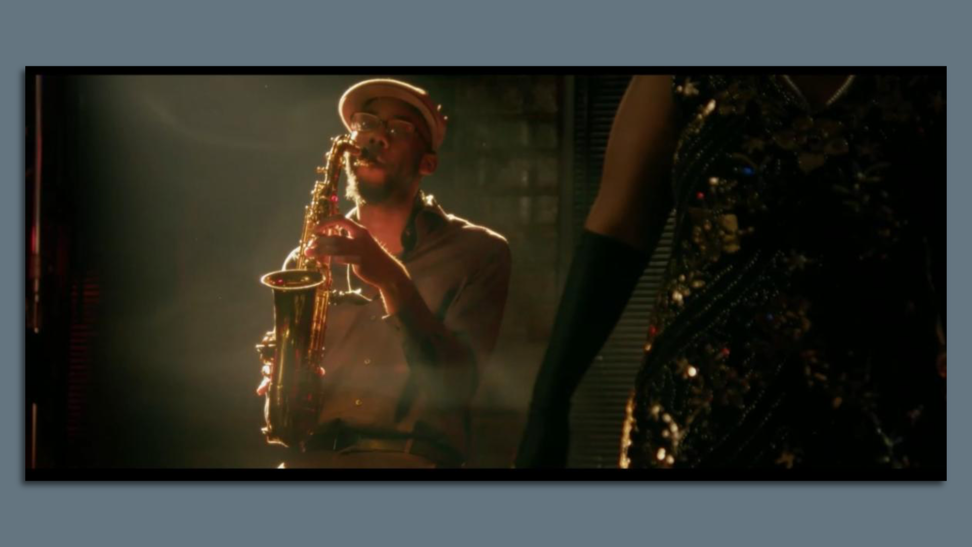 A photo of a saxophone player. 