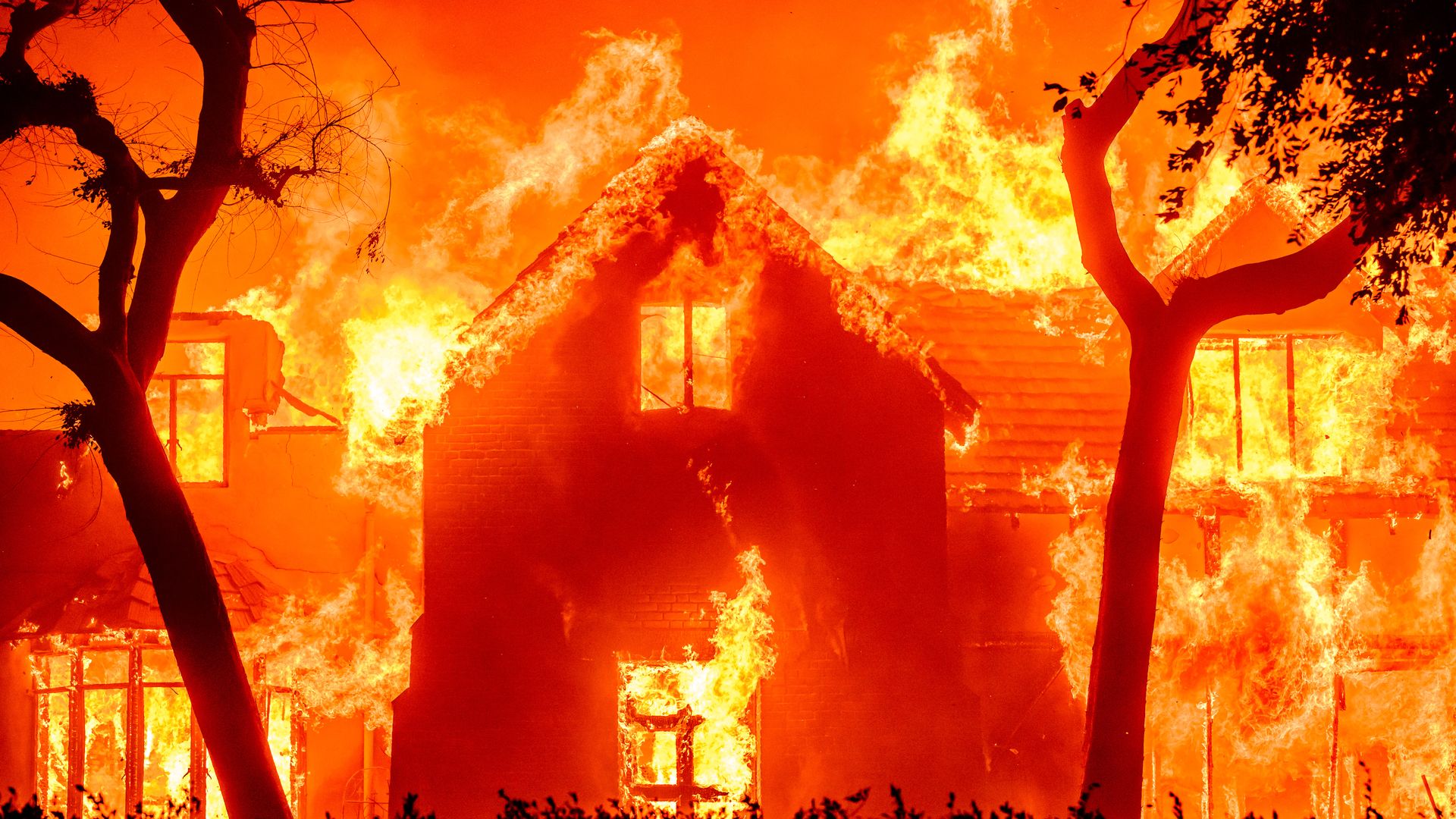  home is engulfed in flames during the Eaton fire in the Altadena area of Los Angeles County, California on January 8, 2025.