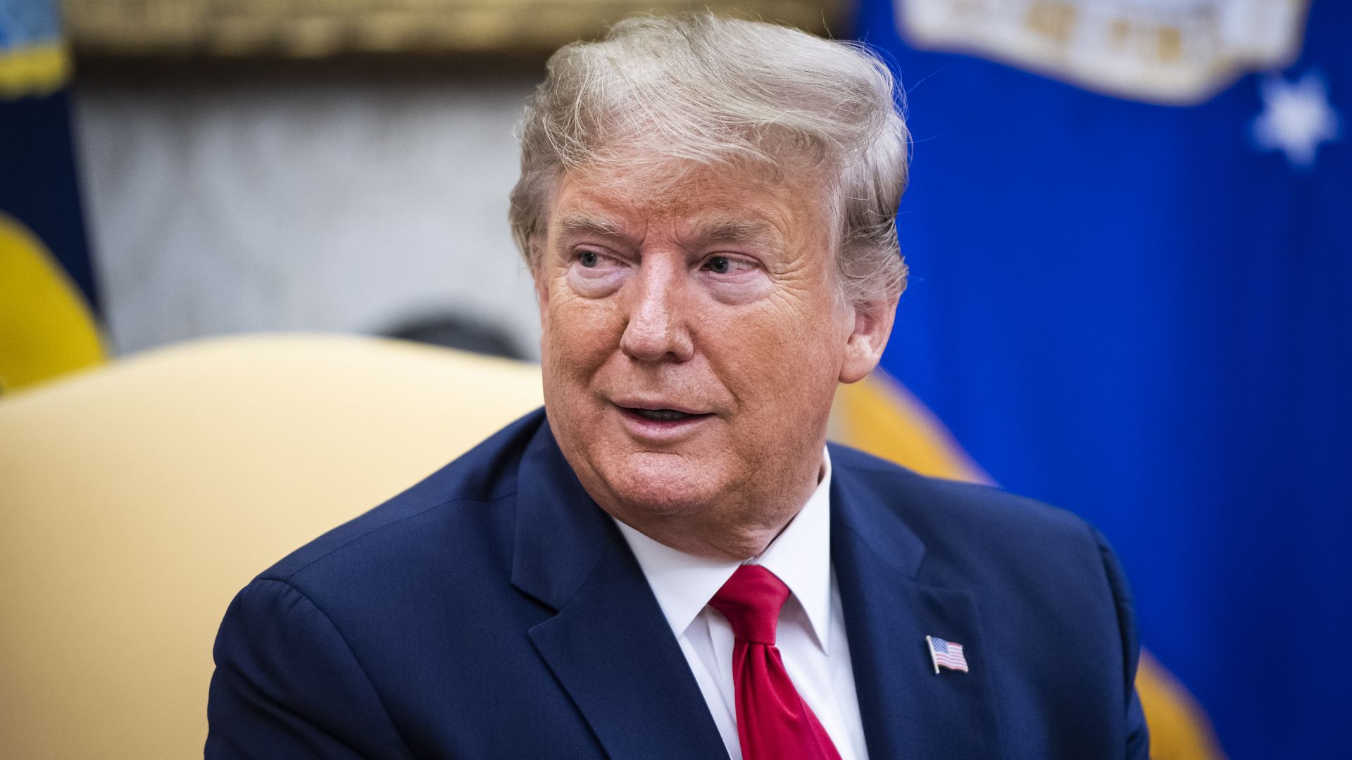 This image shows Trump sitting at the Oval Office desk.