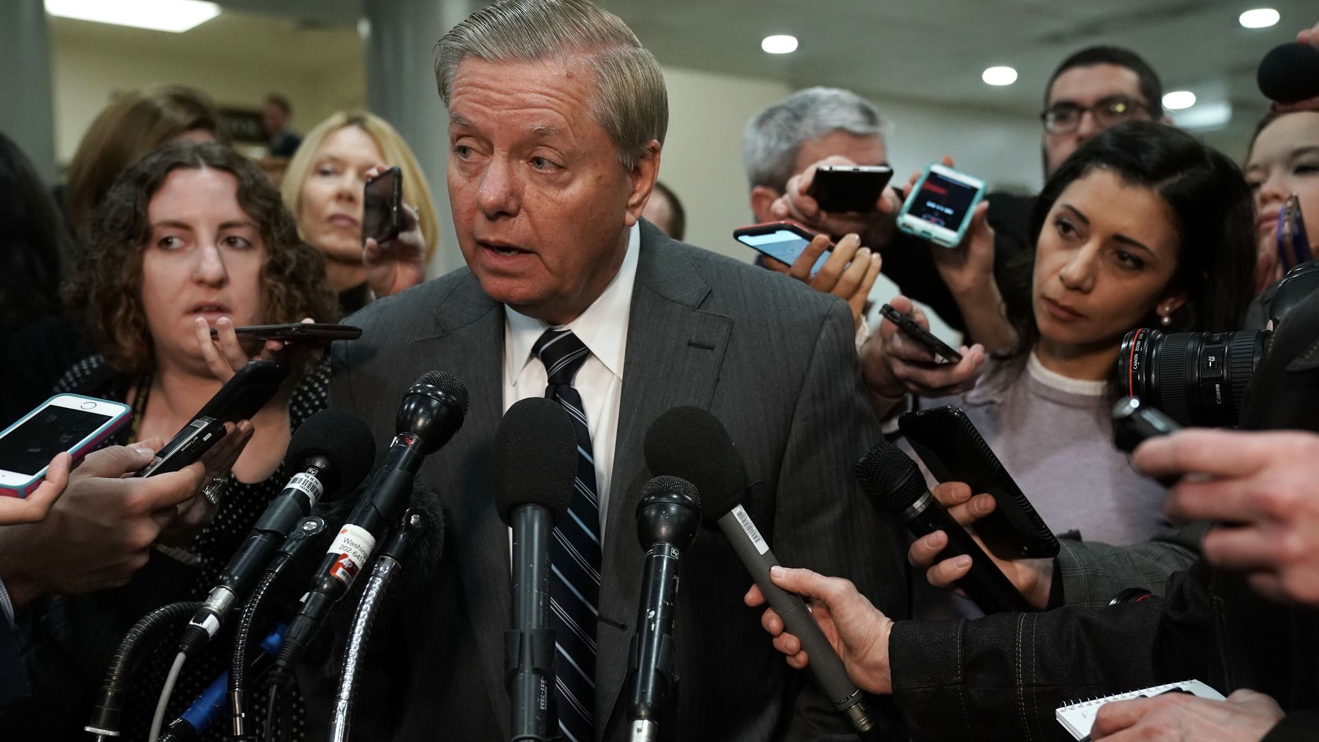Senator Lindsey Graham surrounded by the media.
