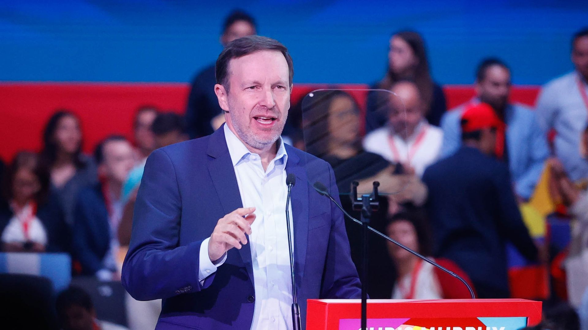 Sen. Chris Murphy talks behind a podium