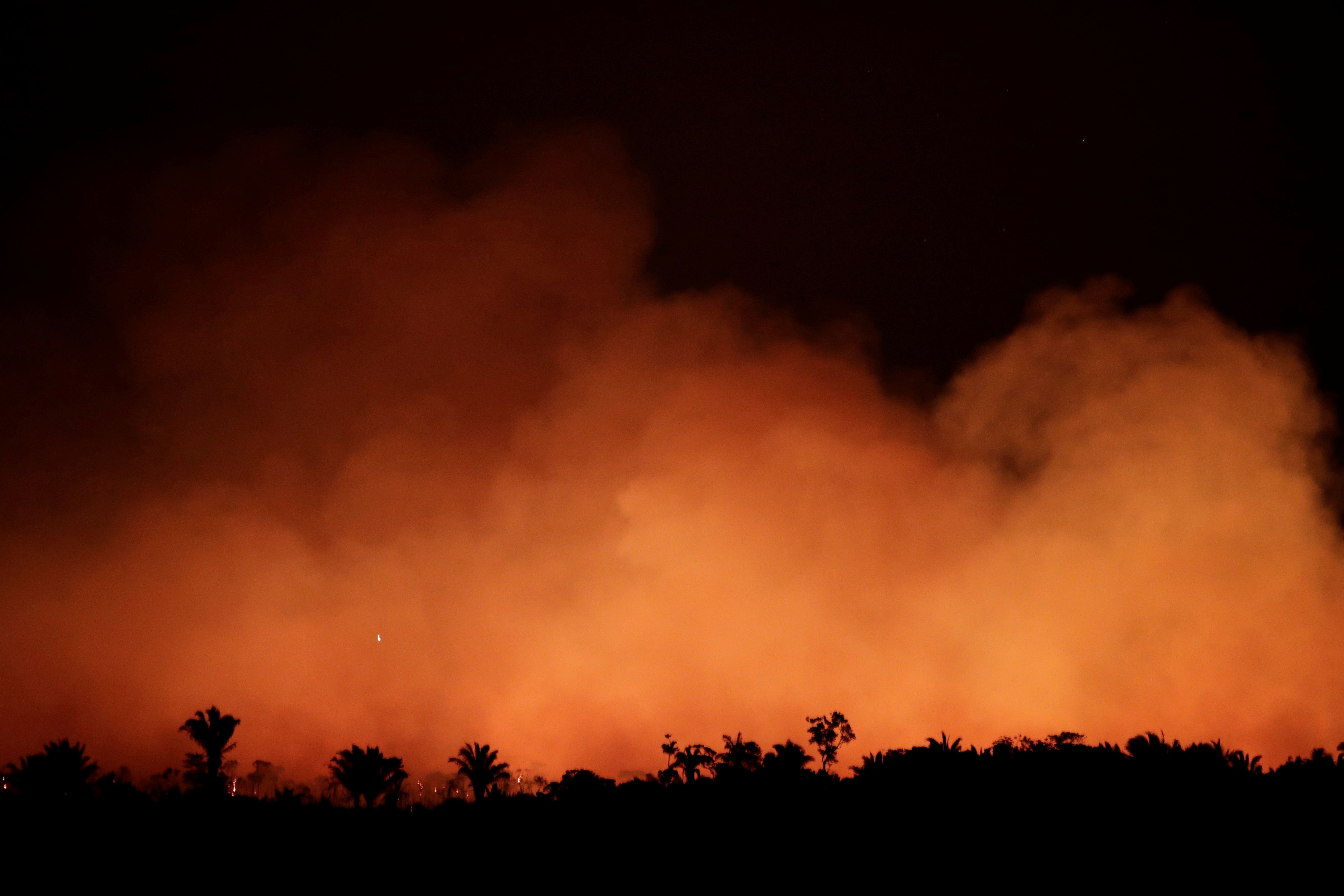 Smoke billows during a fire in an area of the Amazon rainforest.