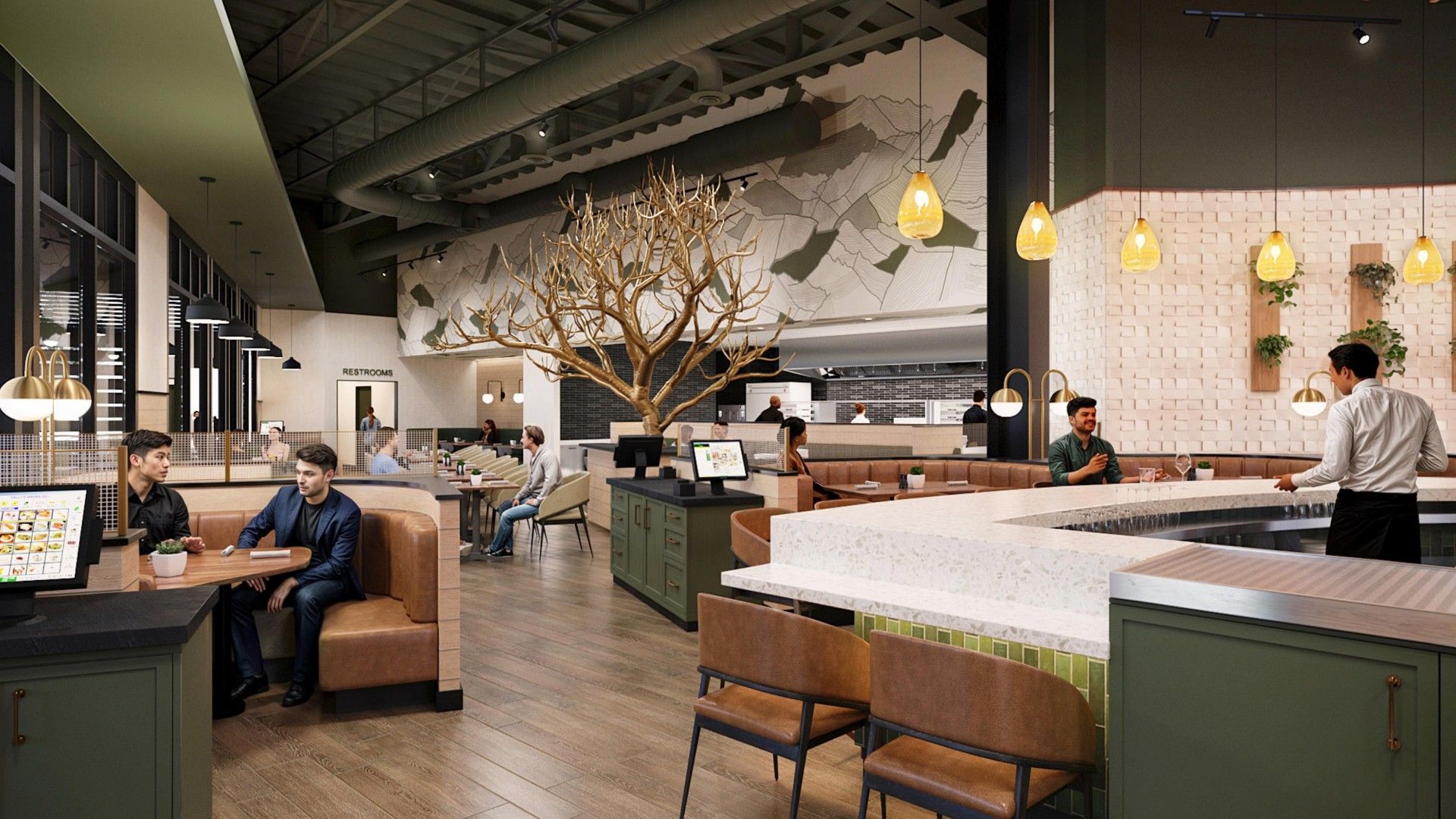 Modern cafeteria with a central leafless tree sculpture, warm pendant lights, green counters, leather booths, and a mountain mural; customers dine as staff serve behind a counter.