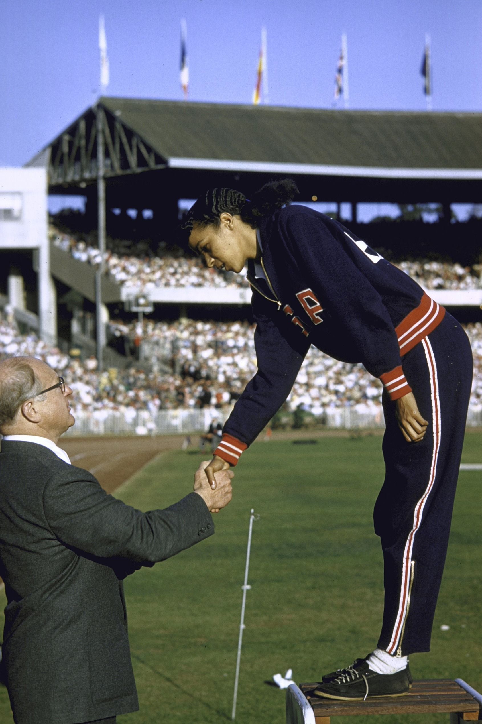 AUSTRALIA - NOVEMBER 22: Track & Field: 1956 Summer Olympics, USA Mildred McDaniel victorious on medal stand shaking hands with IOC President Avery Brundage after winning long jump, Melbourne, AUS 11/22/1956--12/8/1956 (Photo by John G. Zimmerman/Sports Illustrated via Getty Images) (SetNumber: X4258)