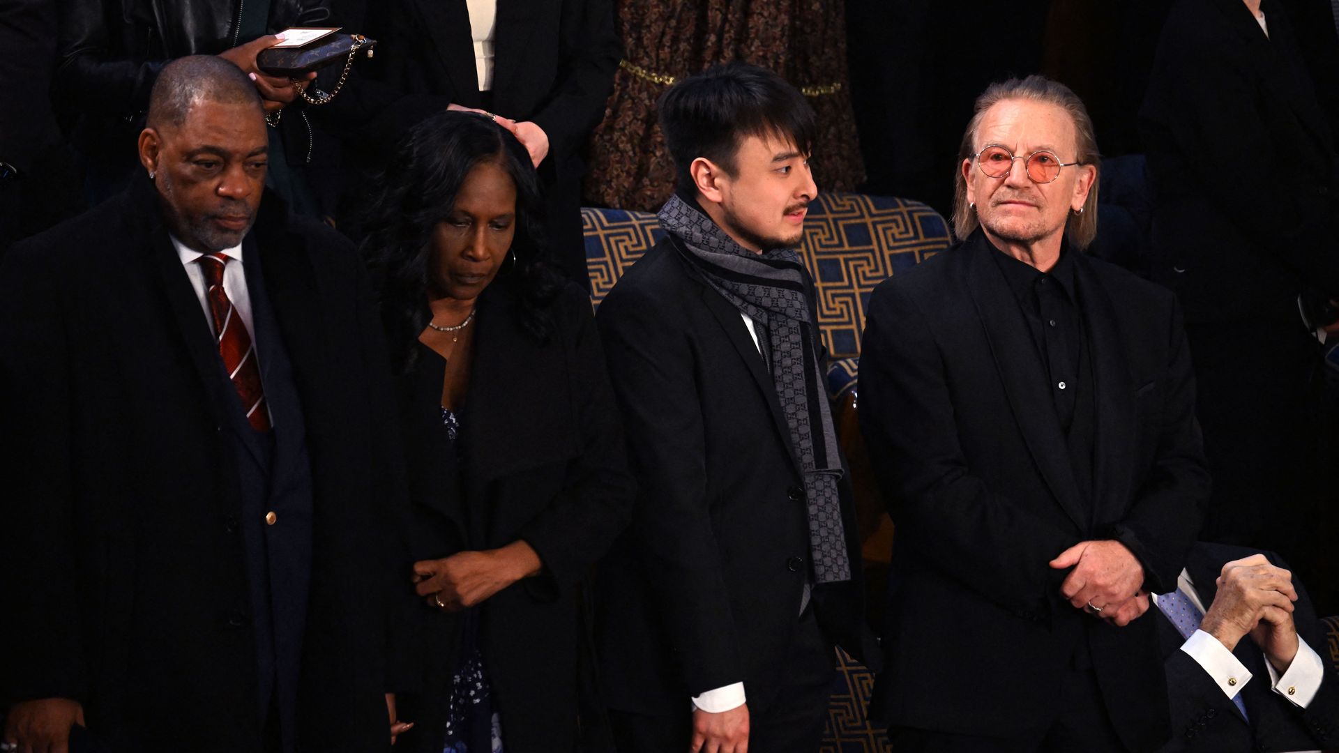 White House guests (L-R) Rodney Wells and RowVaughn Wells, parents of Tyre Nichols; Brandon Tsay, hero of the Monterey, California, shooting; and US frontman Bono 