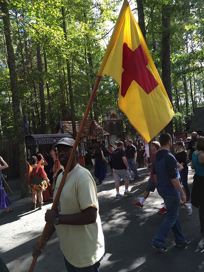 yellow flag with red cross