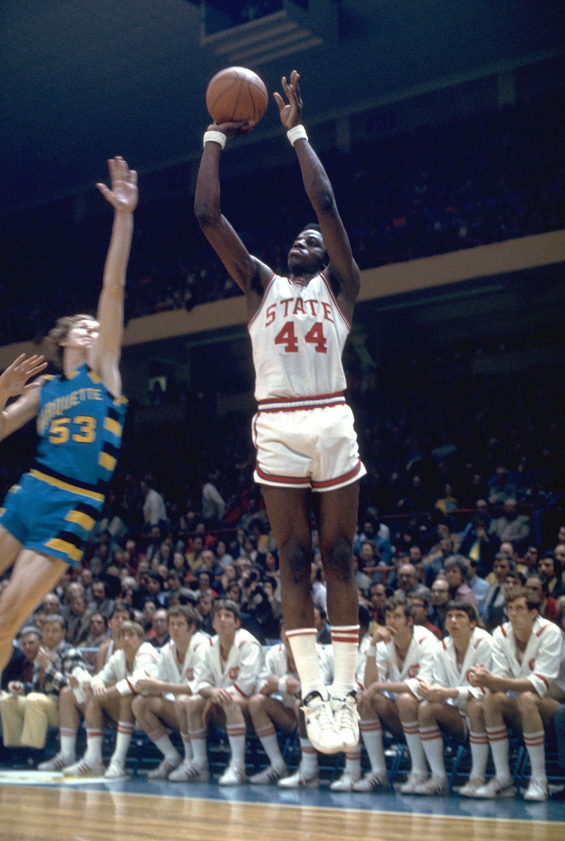 25 MAR 1974: North Carolina State's David Thompson (44) and Marquette forward Rick Campbell (53) during the NCAA Photos via Getty Images Men's National Basketball Final Four championship game held in Greensboro, NC, at the Greensboro Coliseum. North Carolina St. defeated Marquette 76-64 for the title. Photo Copyright Rich Clarkson/NCAA Photos via Getty Images.SI CD 0334-07