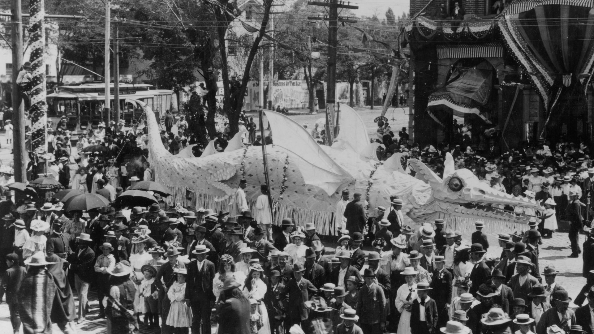 A float shaped like a dragon in a parade in 1897.